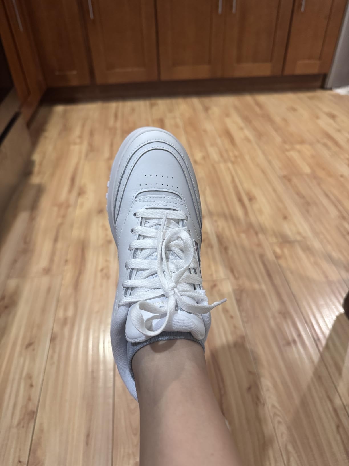 Side profile view of Reebok Club C Extra showing 2-inch platform height and classic silhouette
