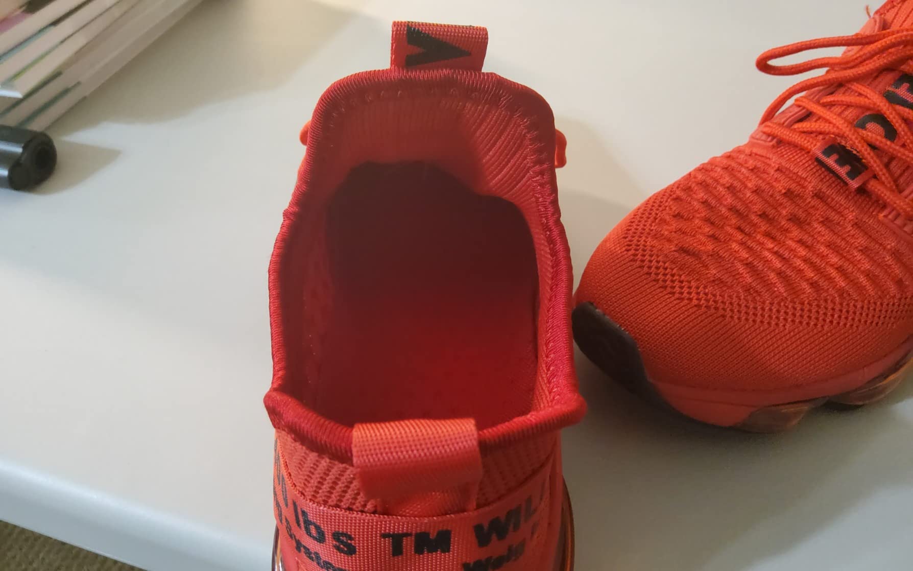 Bottom sole view showing rubber traction pattern and air cushion design