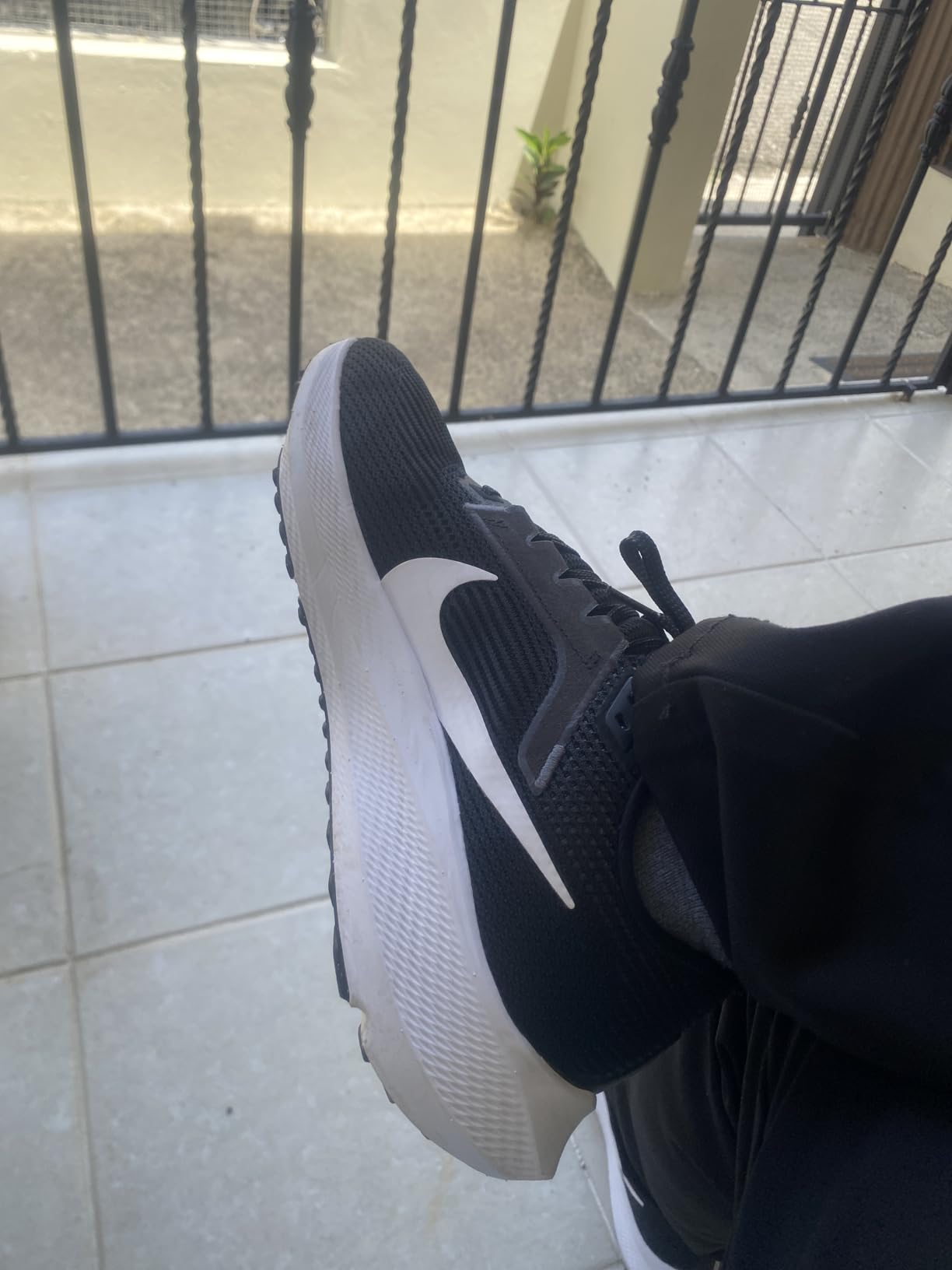Nike Air Zoom Pegasus 37 men's running shoe side profile showing React foam midsole and mesh upper