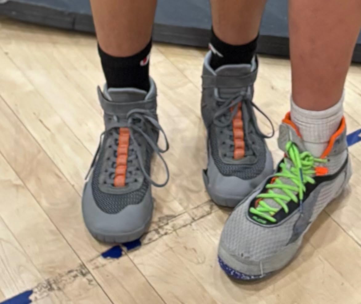Wrestling shoes in training environment showing real-world usage by athletes