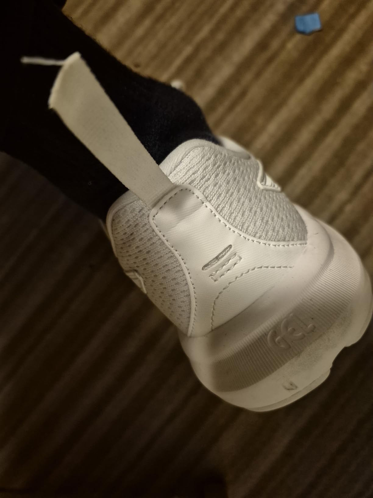Close-up of ASICS Gel-Contend 9 showing lacing system and heel support structure