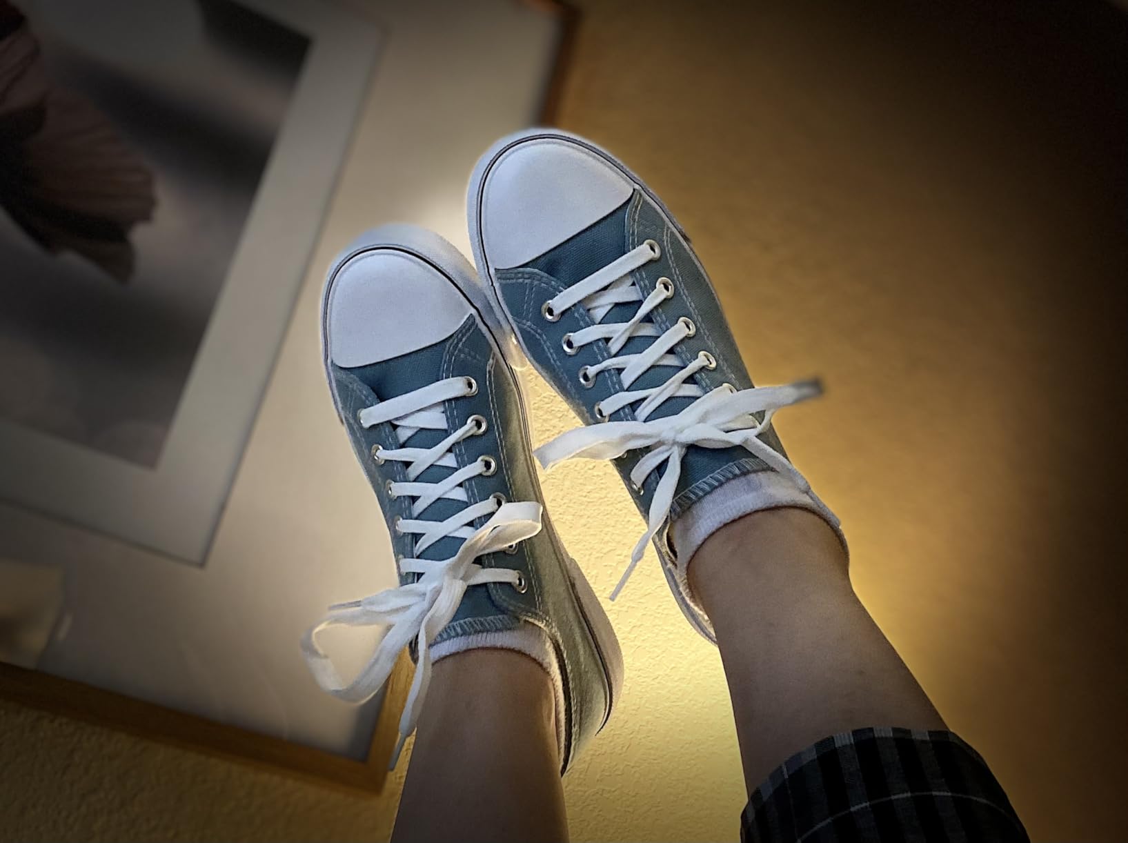 Side profile view of Adokoo sneakers showing rubber sole construction and heel design