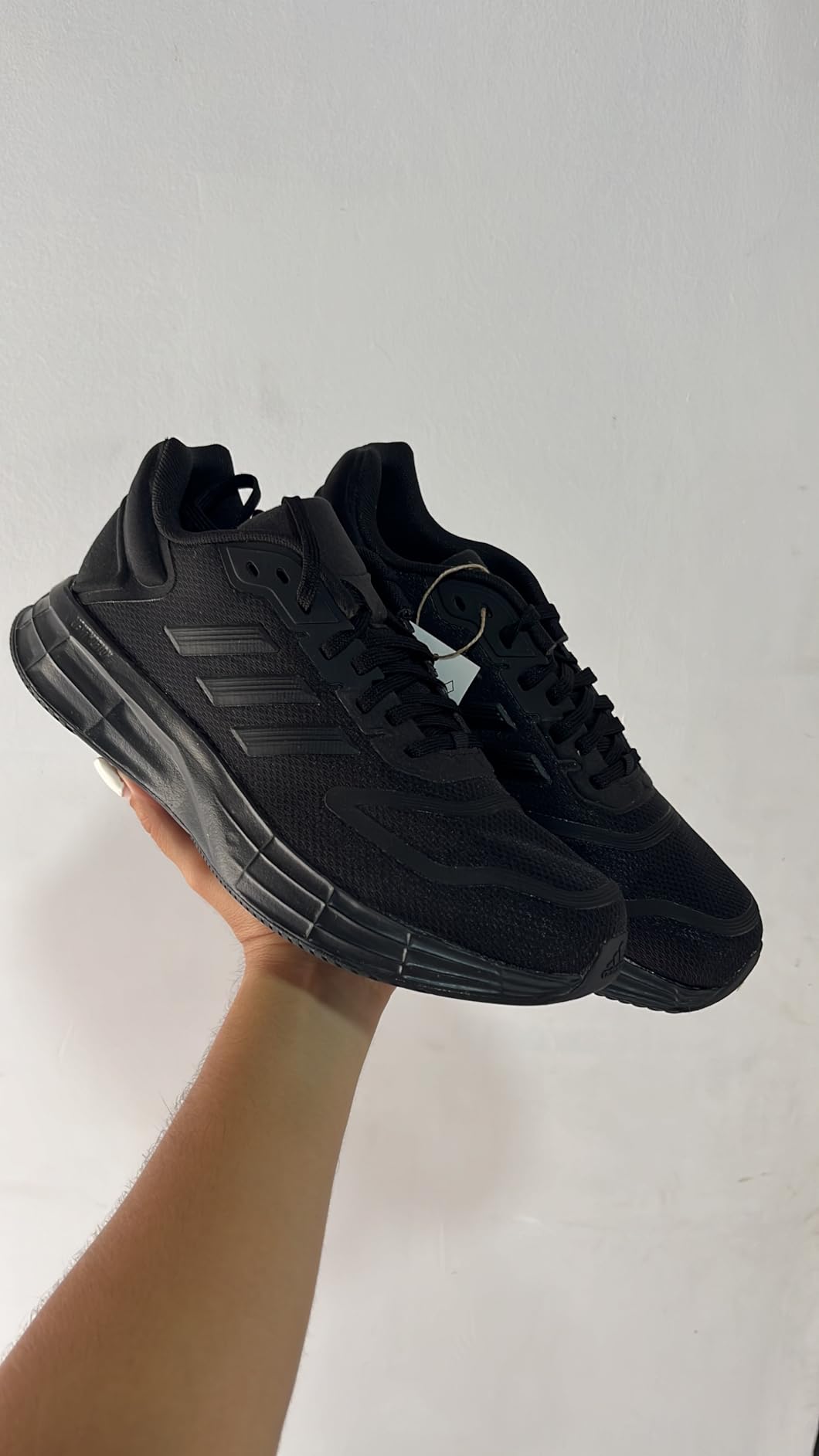 Close-up of LIGHTMOTION midsole cushioning technology and outsole traction pattern