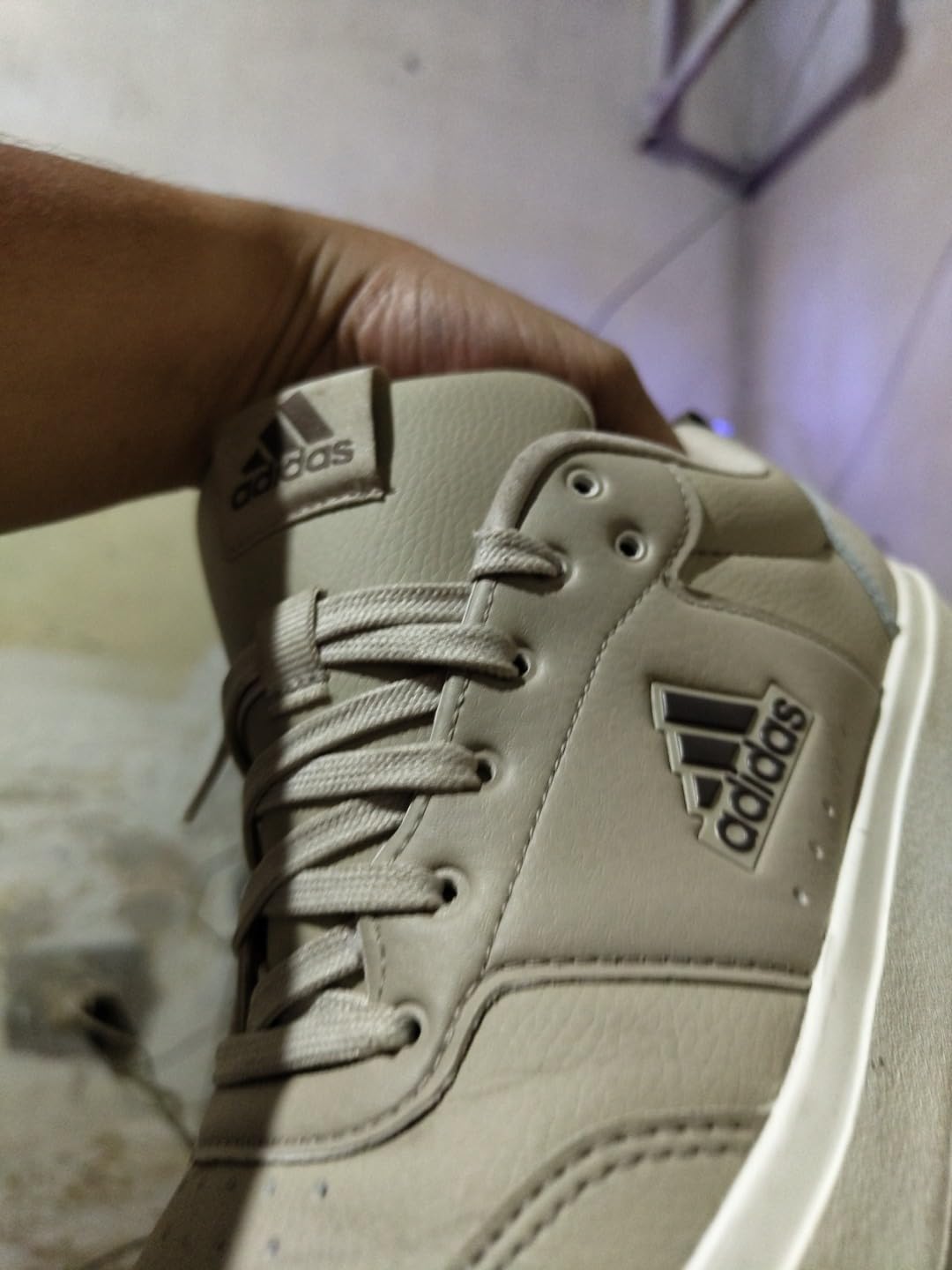 Adidas Park Street sneaker showing Badge of Sport logo and upper material details