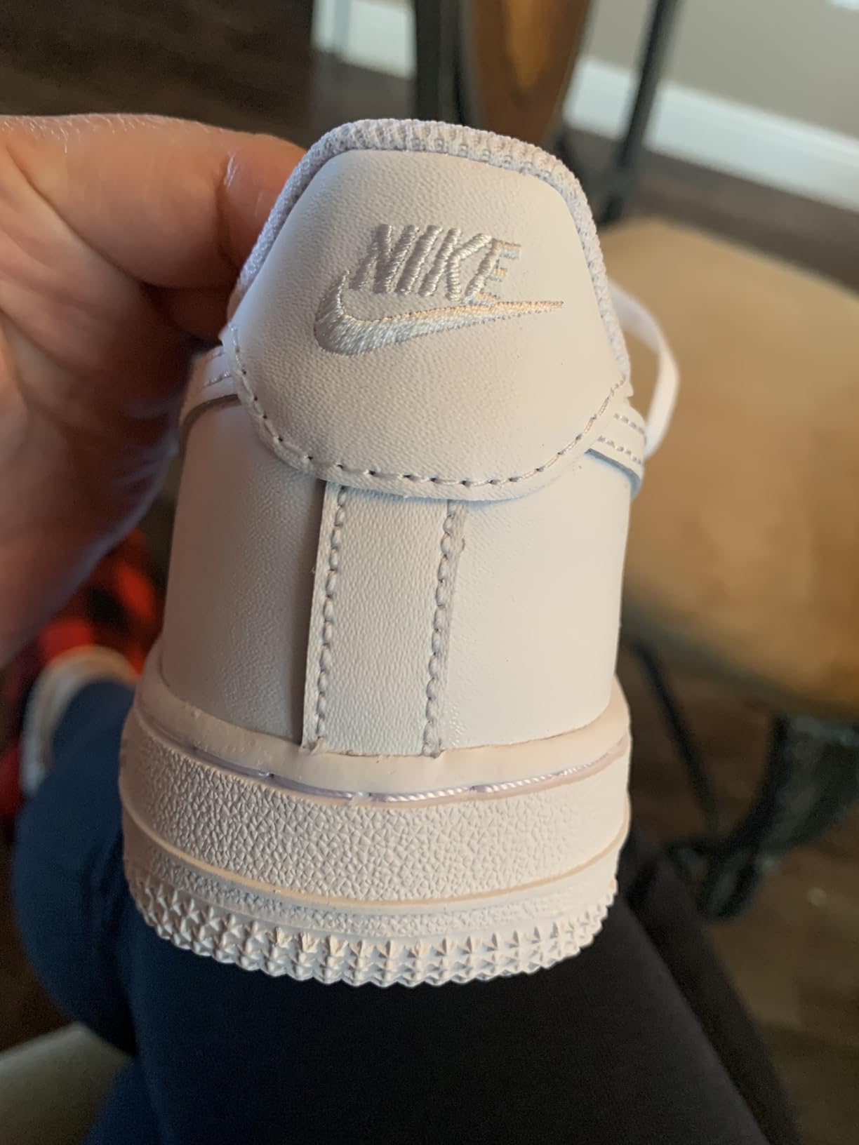 Nike Air Force 1 logo and branding details showing authenticity concerns with missing elements