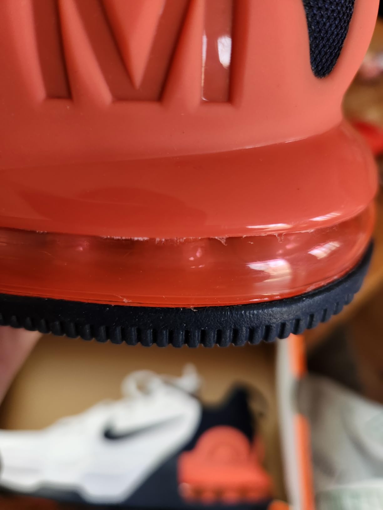 Nike Air Max Alpha Trainer 5 side profile showing flat wide sole design and rubber wrap construction