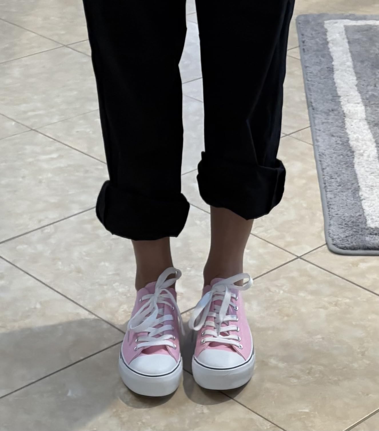 Multiple colorways of Adokoo canvas sneakers displayed together showing variety