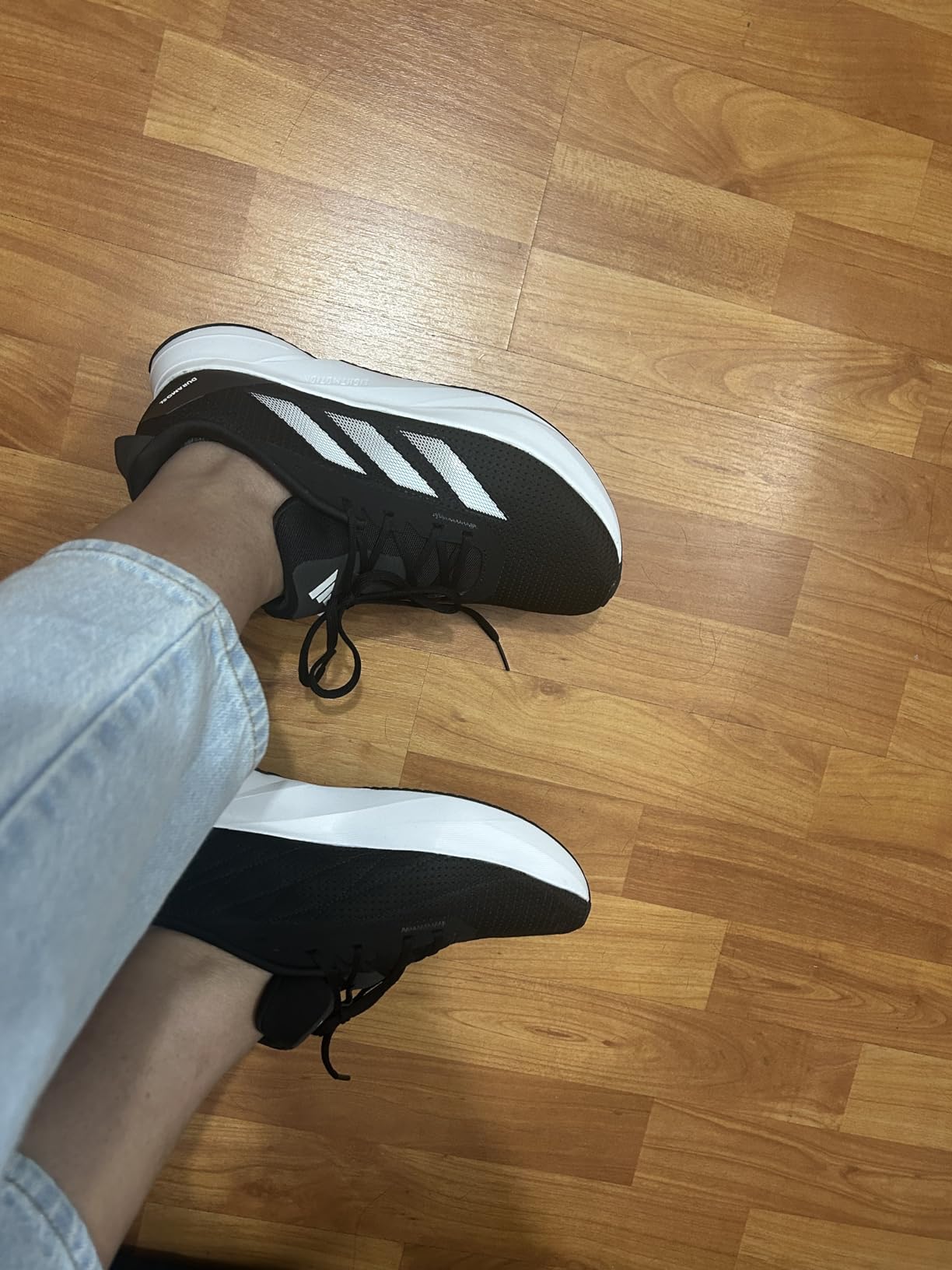 Adidas Duramo SL lifestyle shot showing versatility for casual and athletic wear