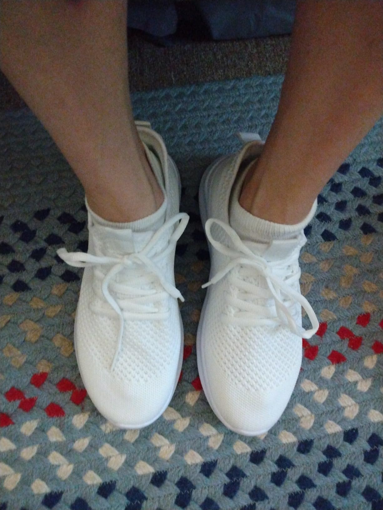 Side profile view of WYGRQBN walking shoes showing lightweight EVA sole and mesh construction details