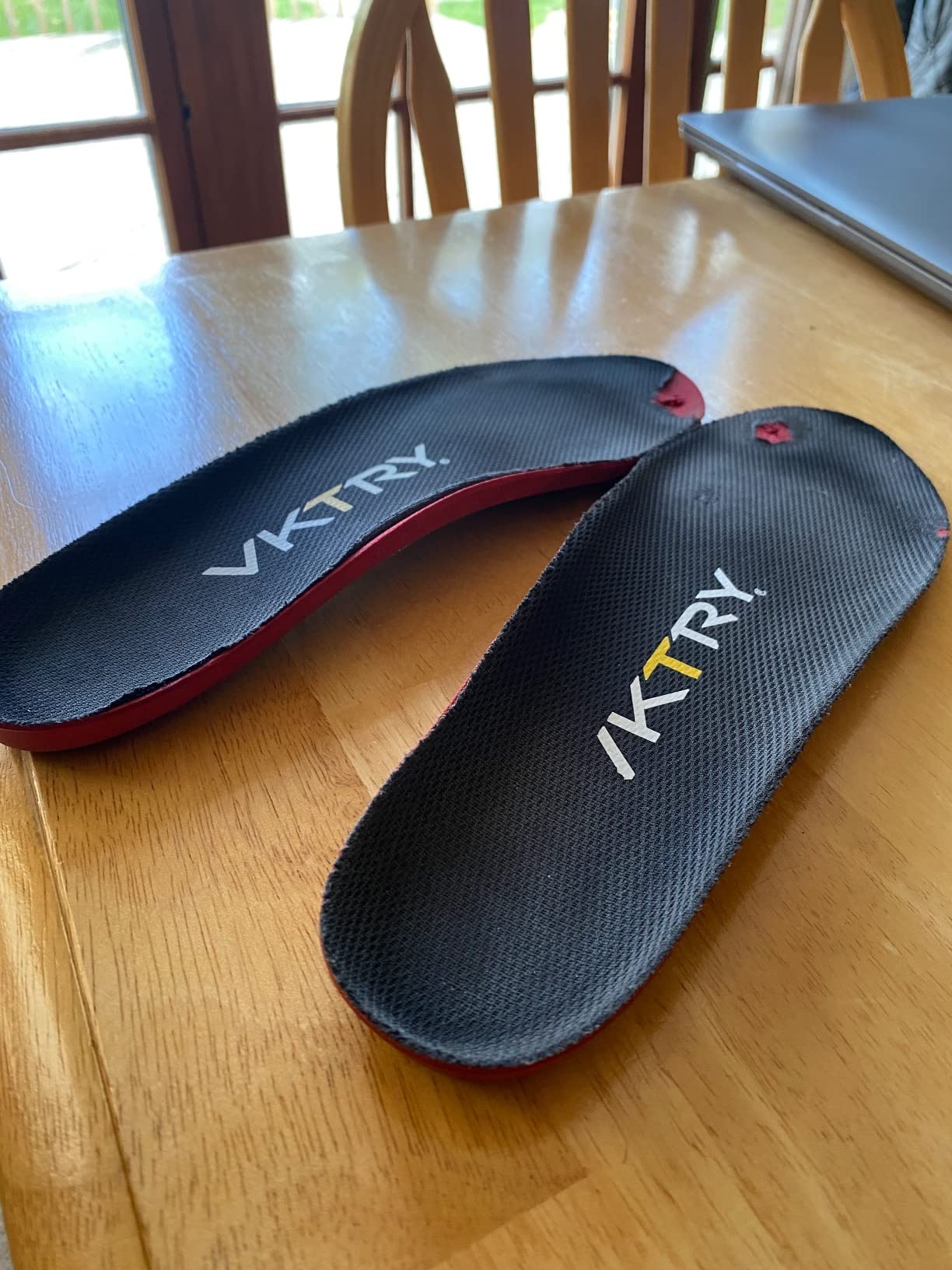 Comparison showing VKTRY insole condition after 4 months of use with visible wear patterns