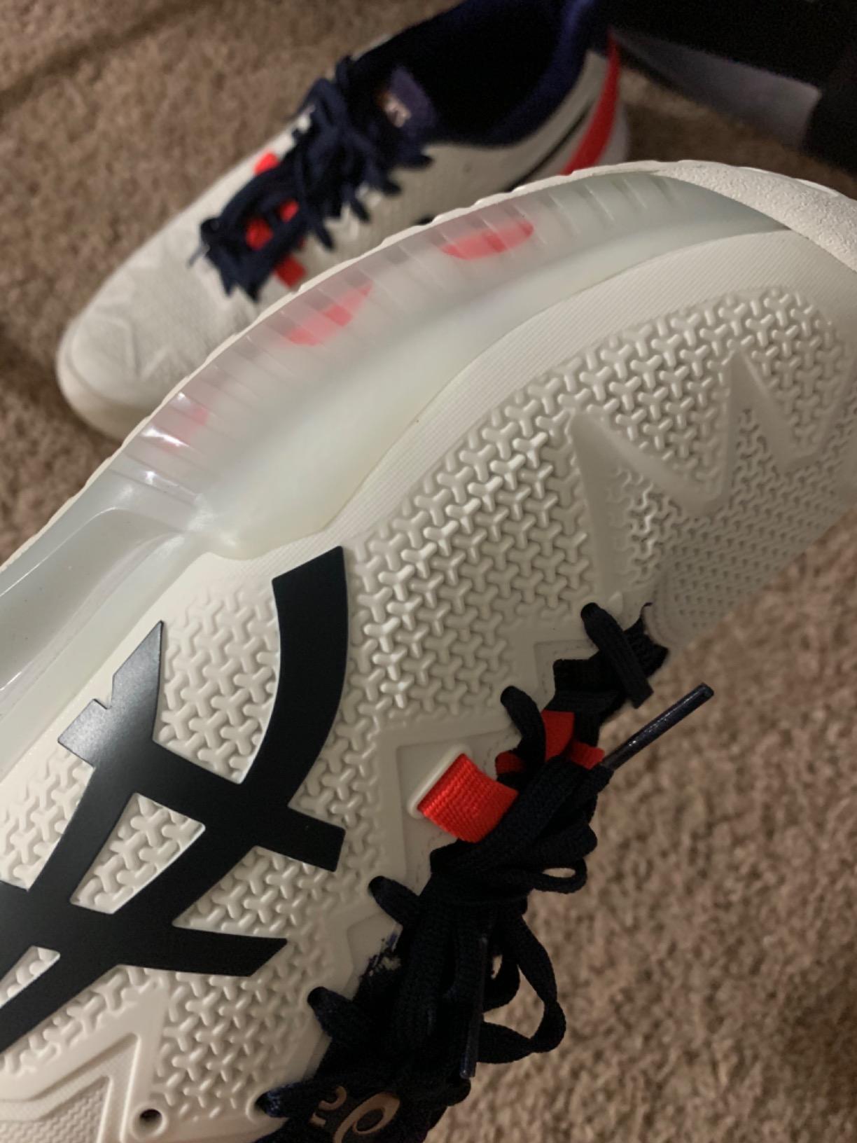 Close-up view of ASICS Gel-Resolution 8 upper construction showing Flexion Fit technology and lacing system