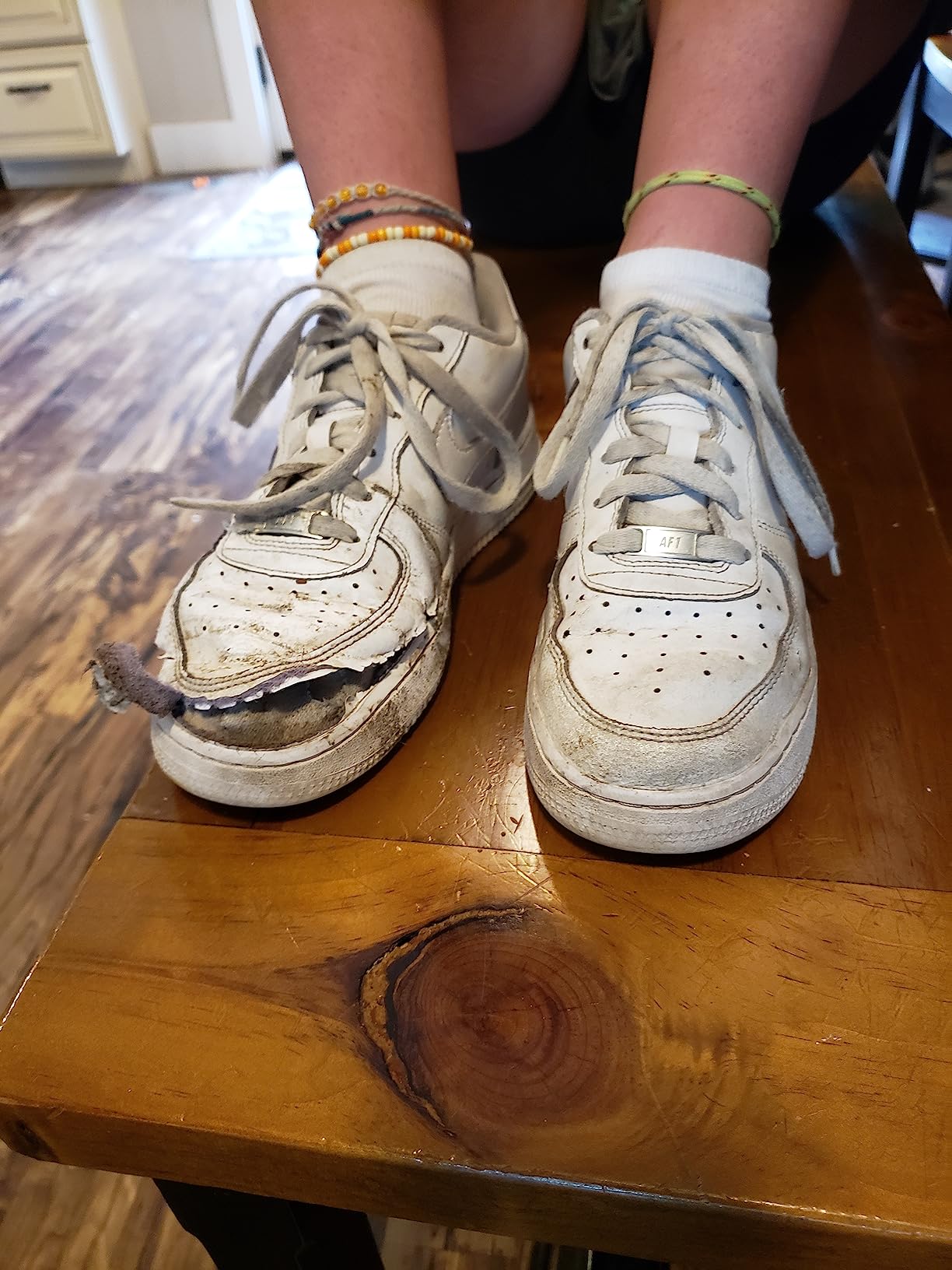 Nike Air Force 1 showing durability failure with hole development after months of wear