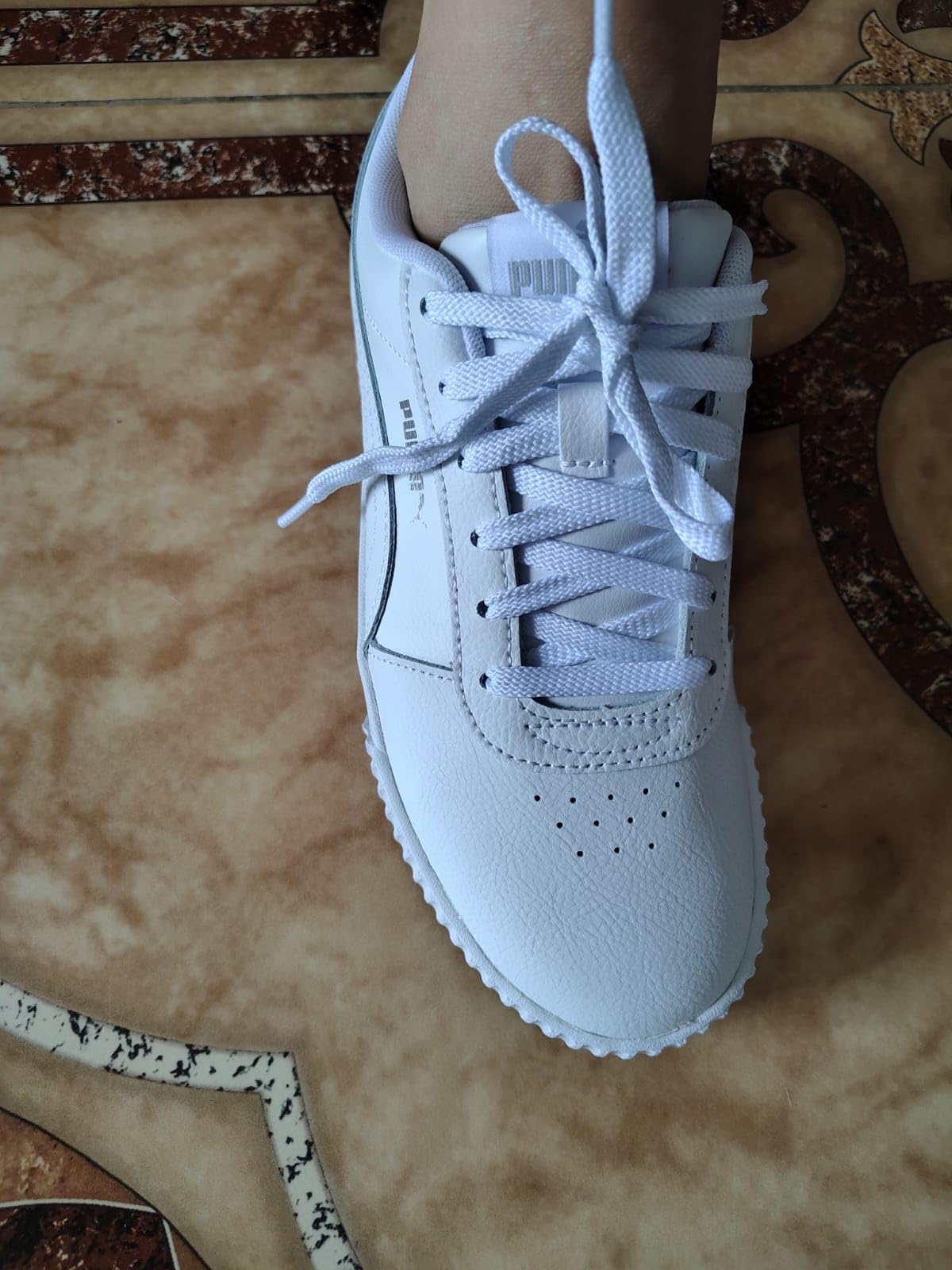 PUMA Carina L sneaker showing durability after weeks of wear in various conditions