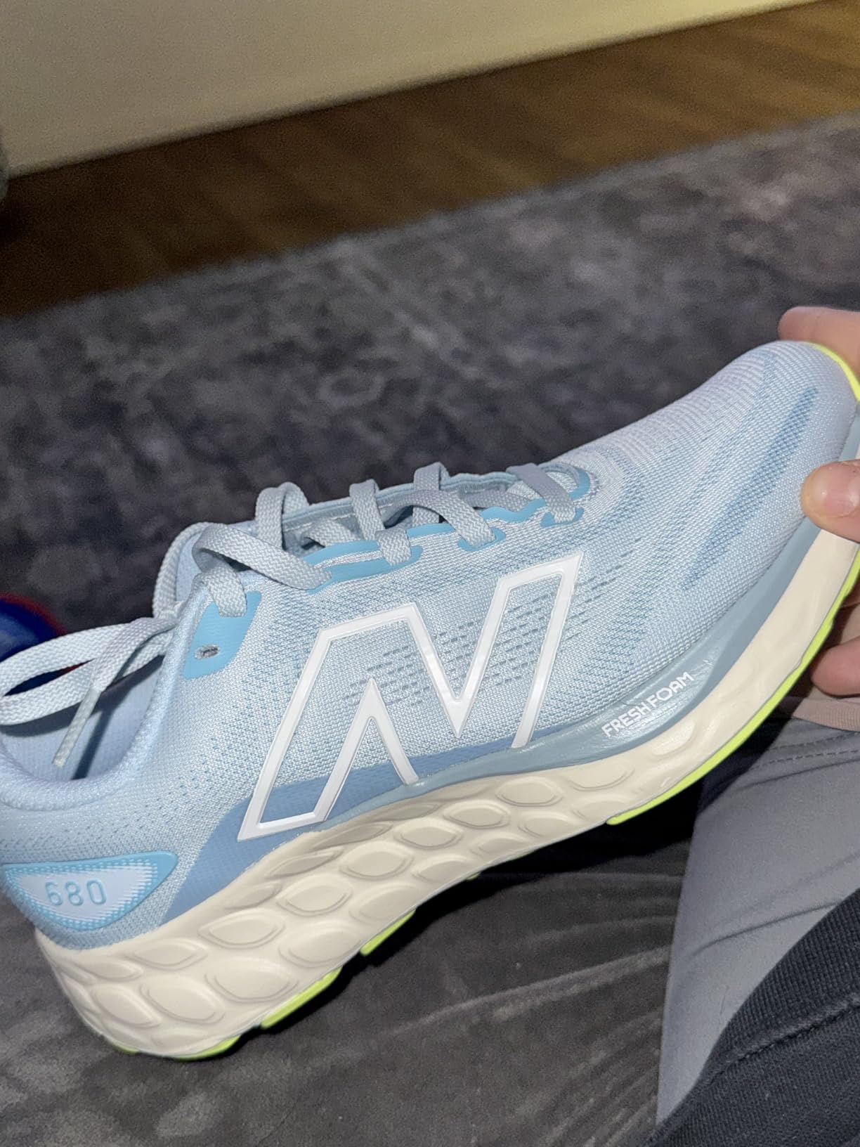 New Balance Women's Fresh Foam 680 V8 running shoe light blue colorway with green accents