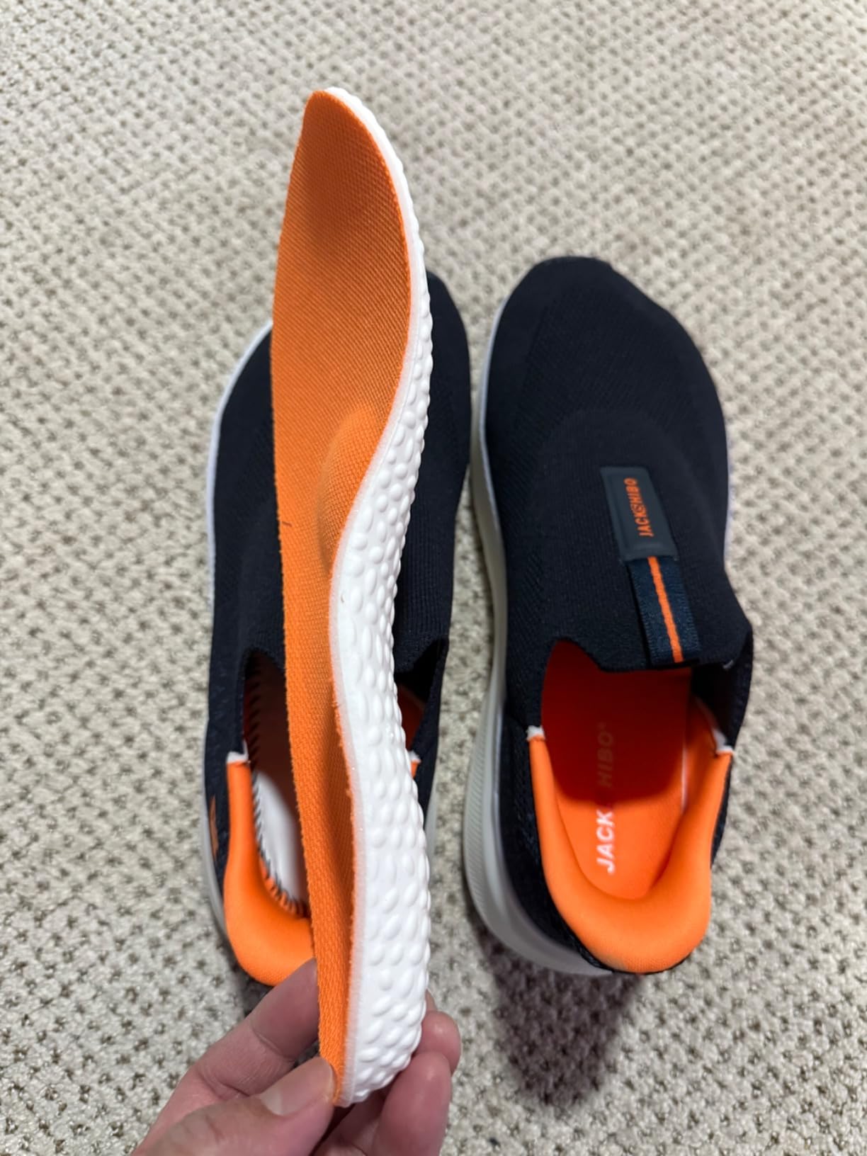 Detailed sole view showing thick rubber outsole pattern and cushioning technology