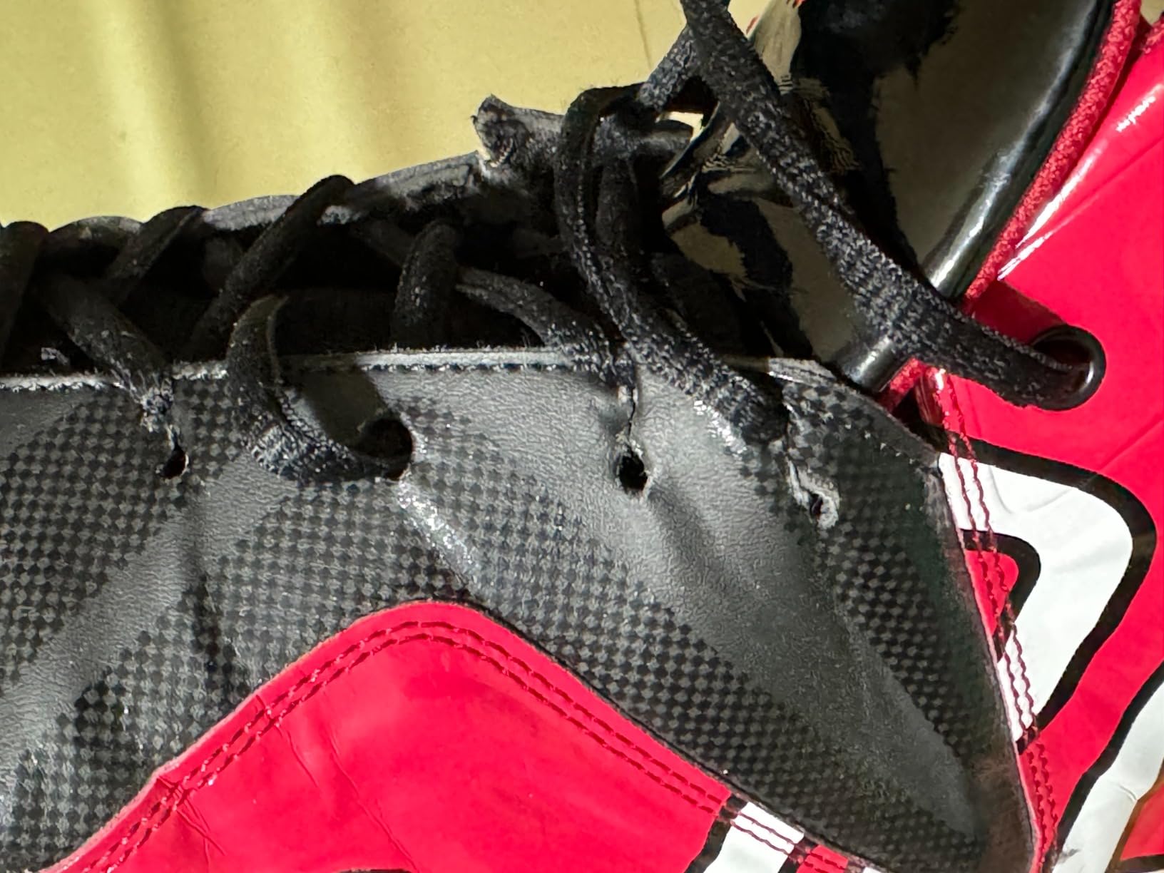 ASHION basketball shoes showing lace eyelet damage and construction issues after regular use