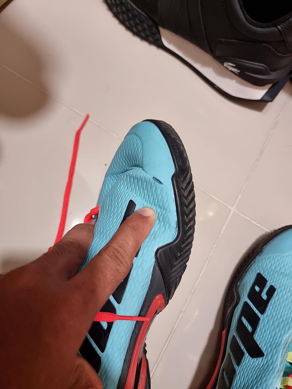 Multiple angles showing Adidas Barricade deterioration after less than one month of intensive use