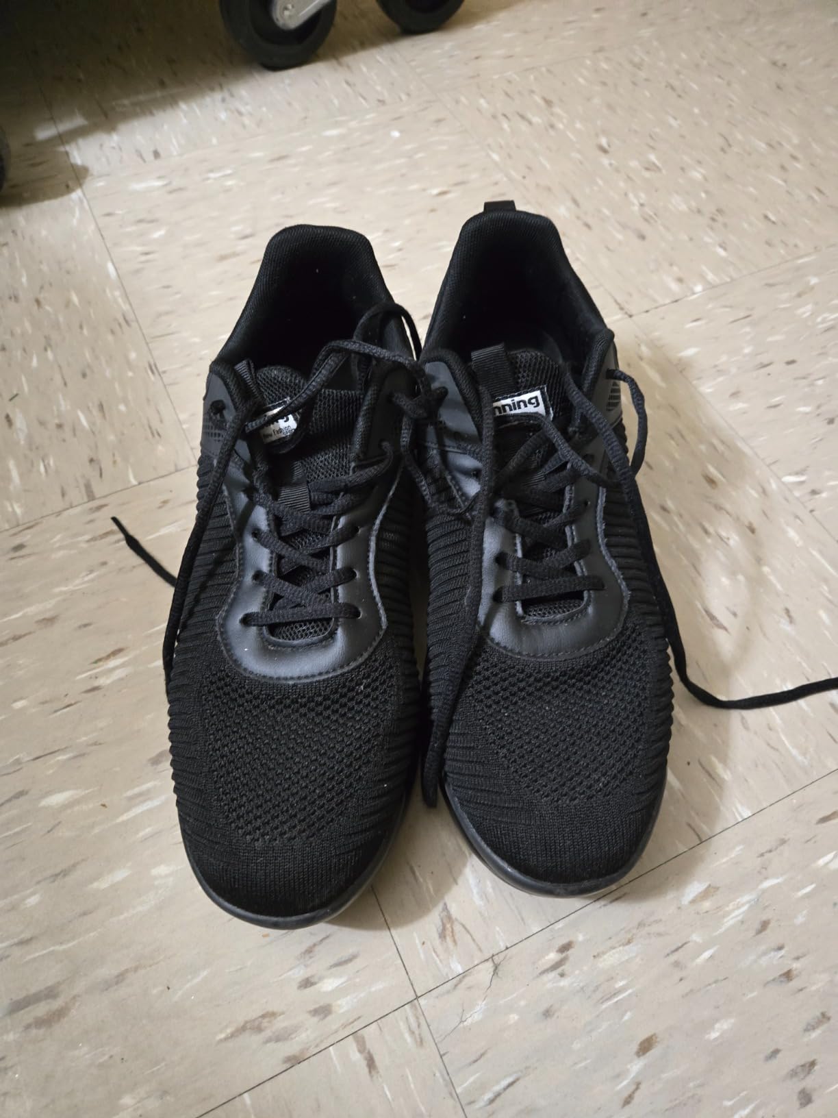 Men's sneakers detail showing breathable mesh upper construction and lacing system