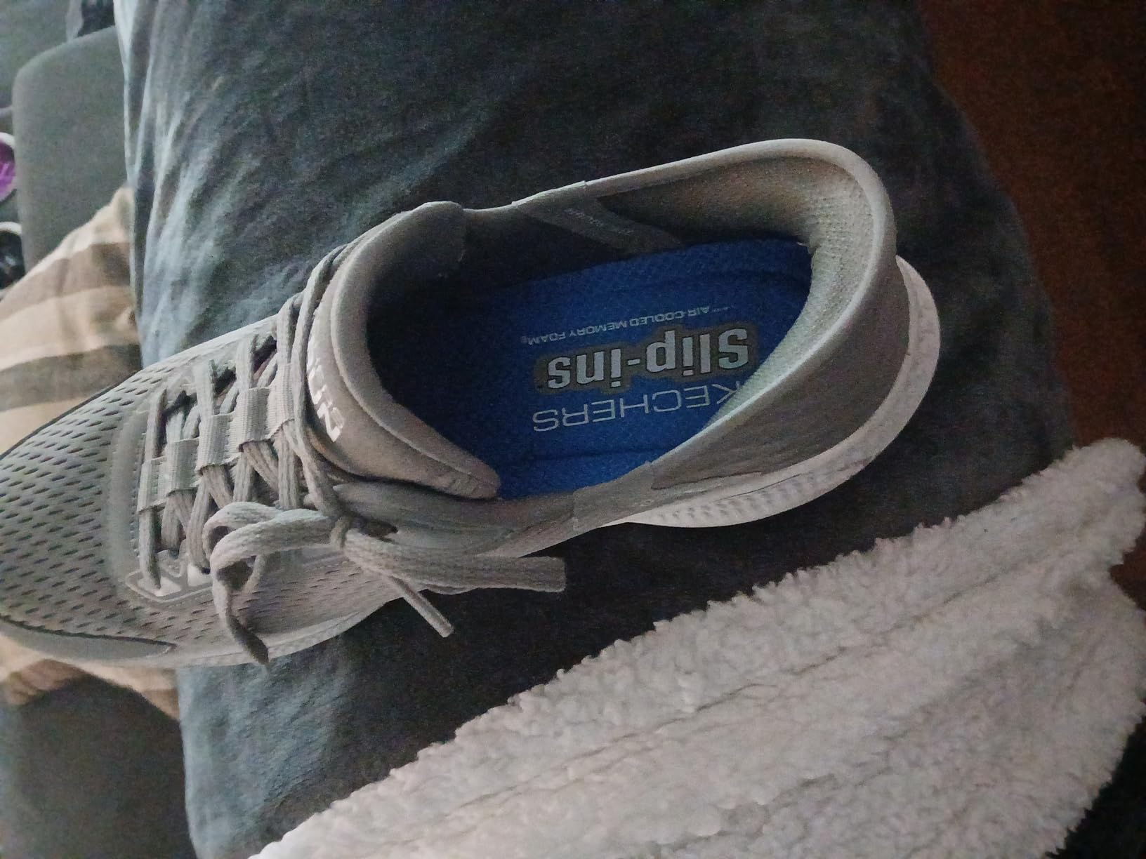 Skechers lacing system detail showing how slip-in technology works with traditional laces