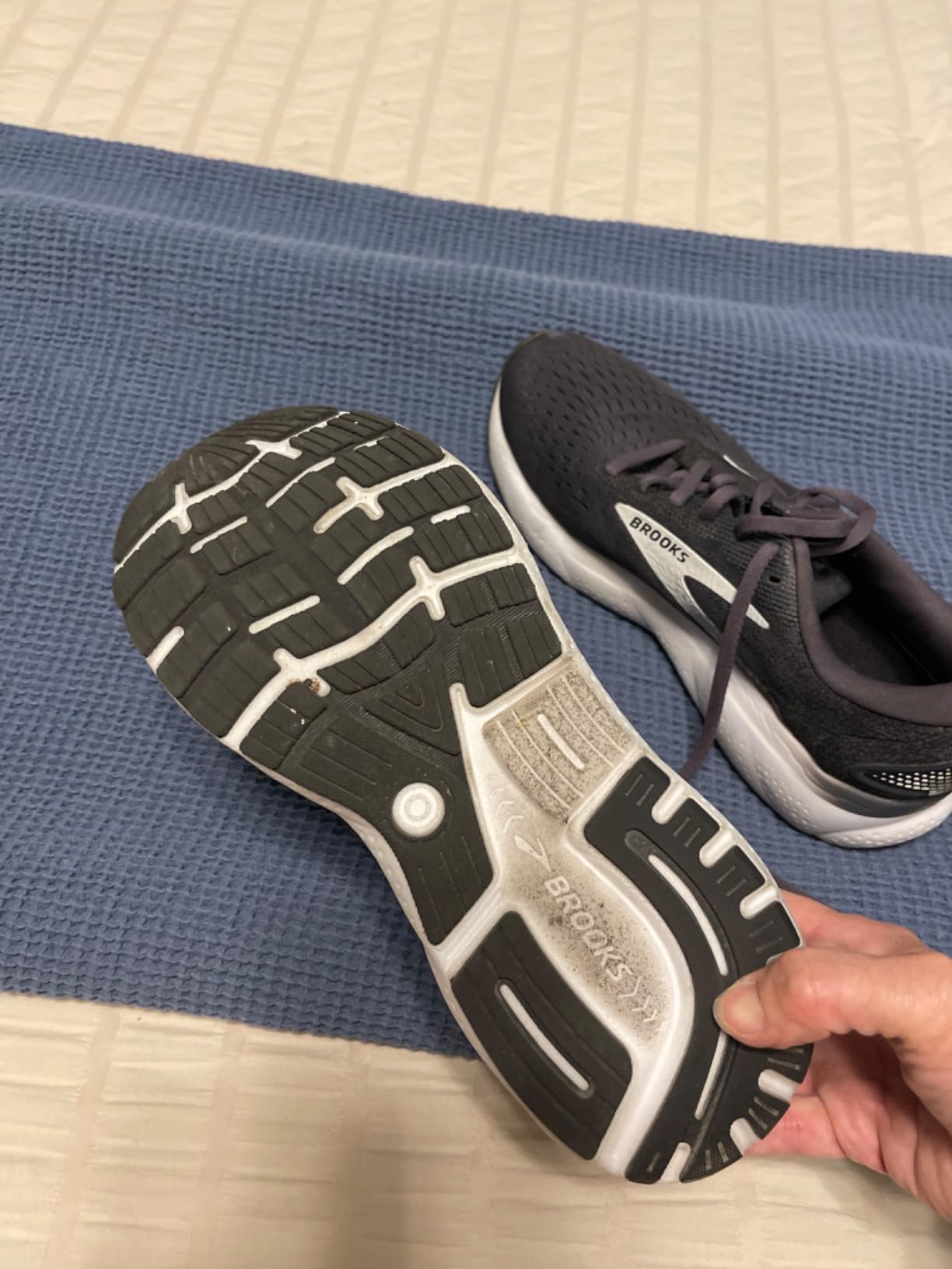 Brooks Ghost 16 performance testing on wet pavement showing RoadTack rubber traction