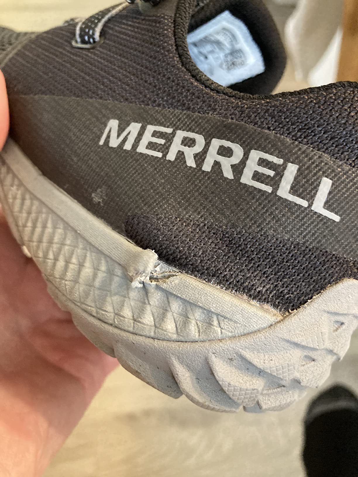 Close-up showing potential sole separation issue on Trail Glove 6 heel area