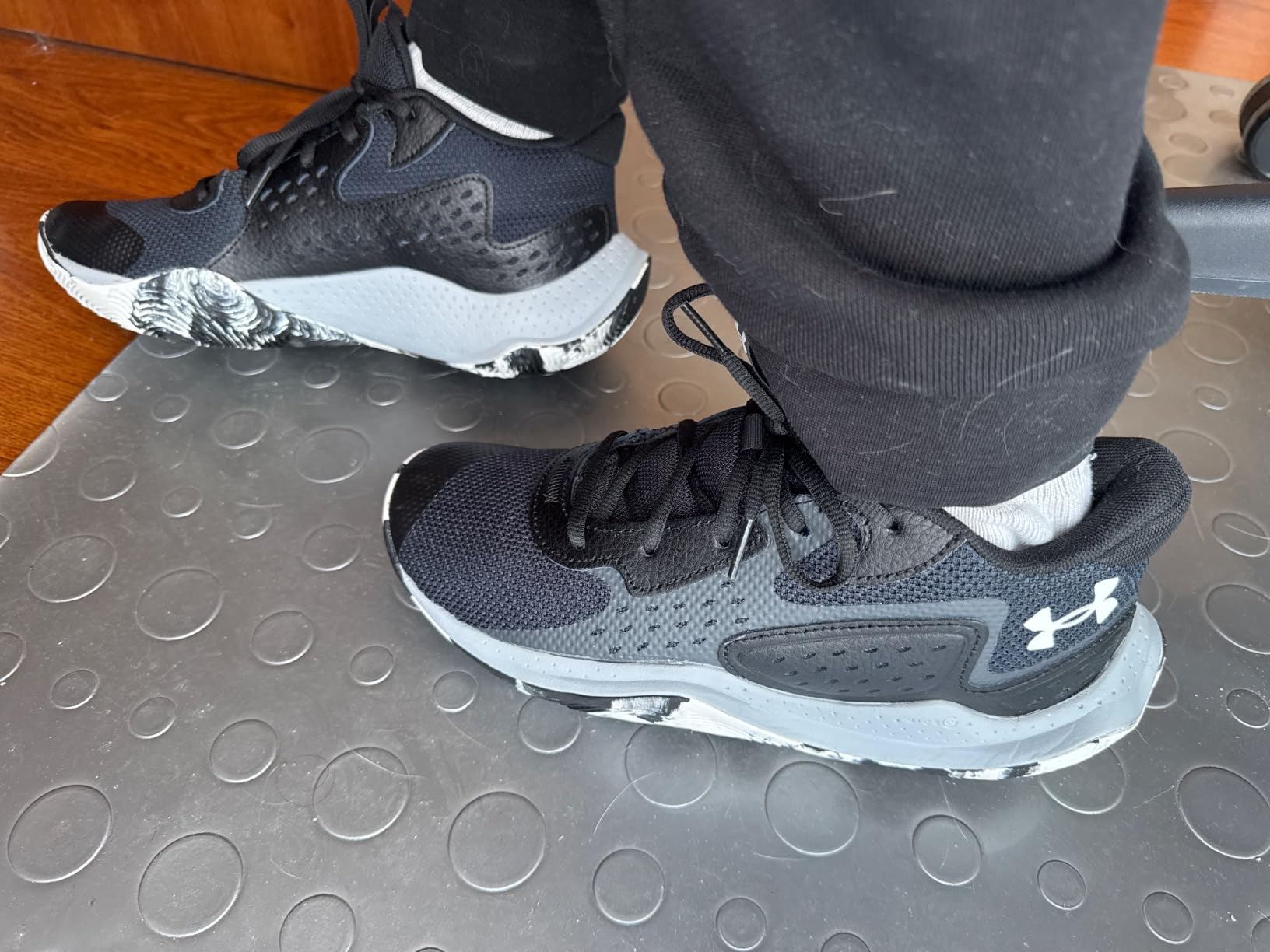 Community basketball players wearing Under Armour Jet 23 shoes during game action
