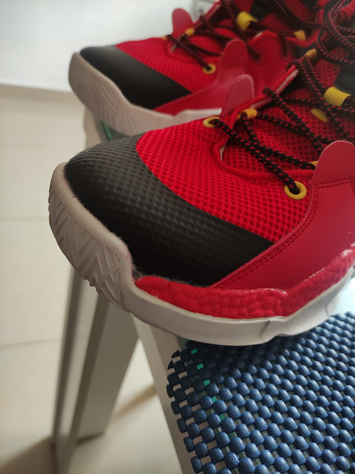 Final assessment of ASHION basketball shoes showing construction details and overall build quality