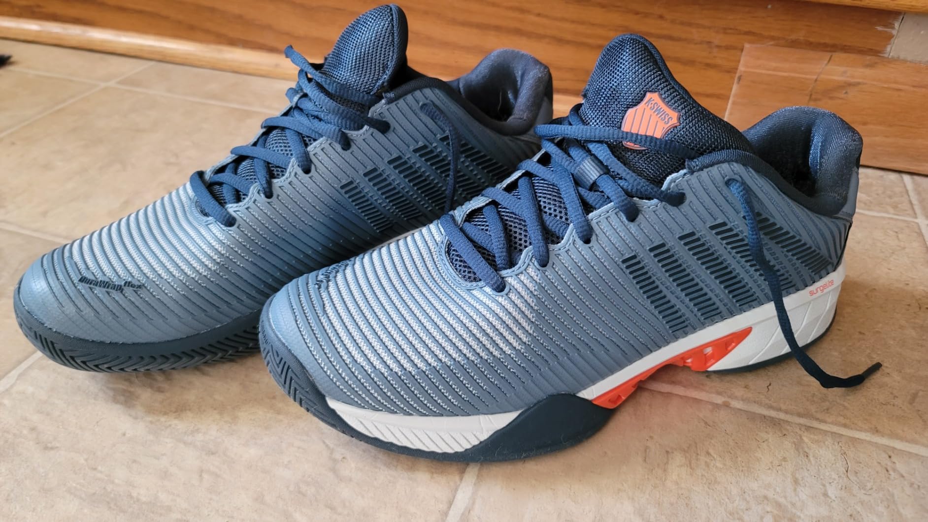 K-Swiss Hypercourt Express 2 tennis shoes on court action shot showing grip and stability during play