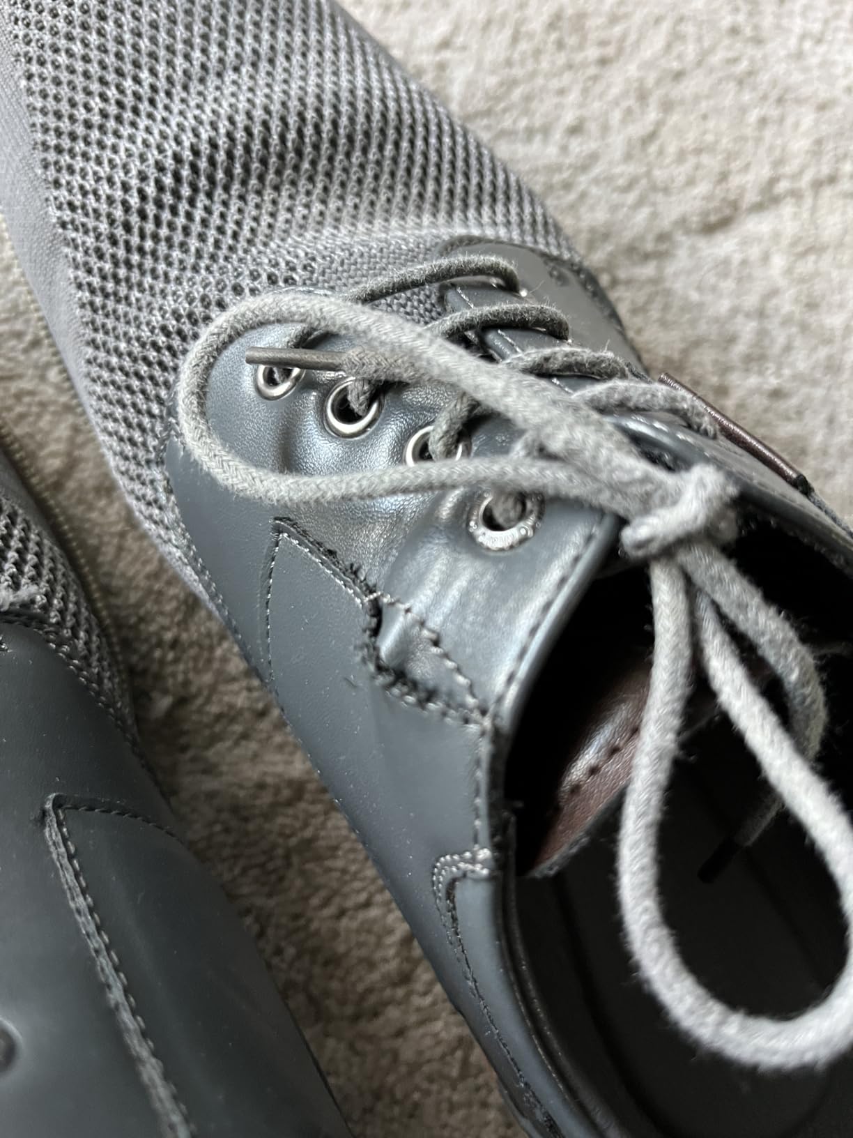 Close-up showing seam separation issue on Bruno Marc dress shoe after extended wear