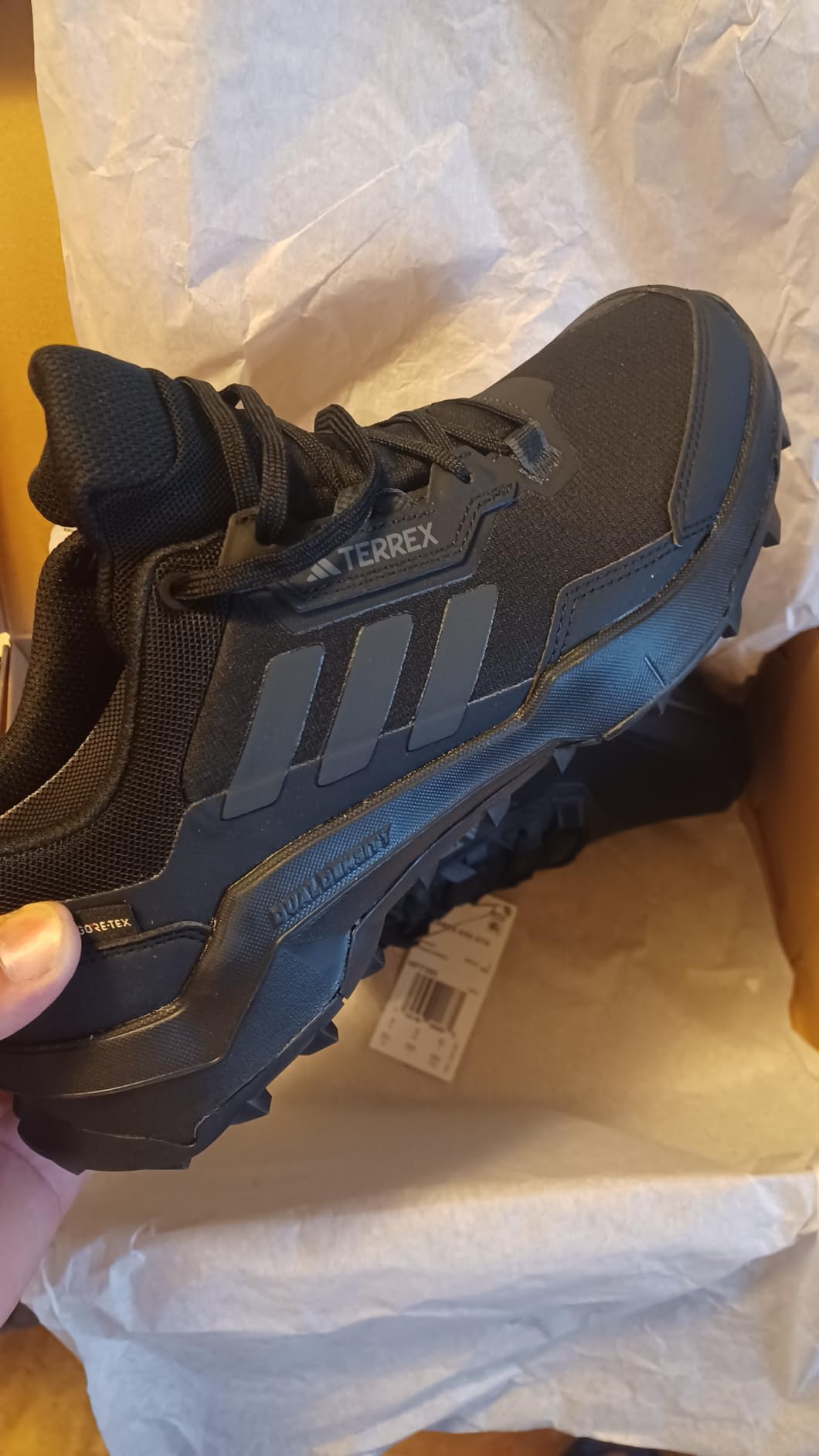 Detail shot of Adidas Terrex AX4 showing lacing system and upper construction quality