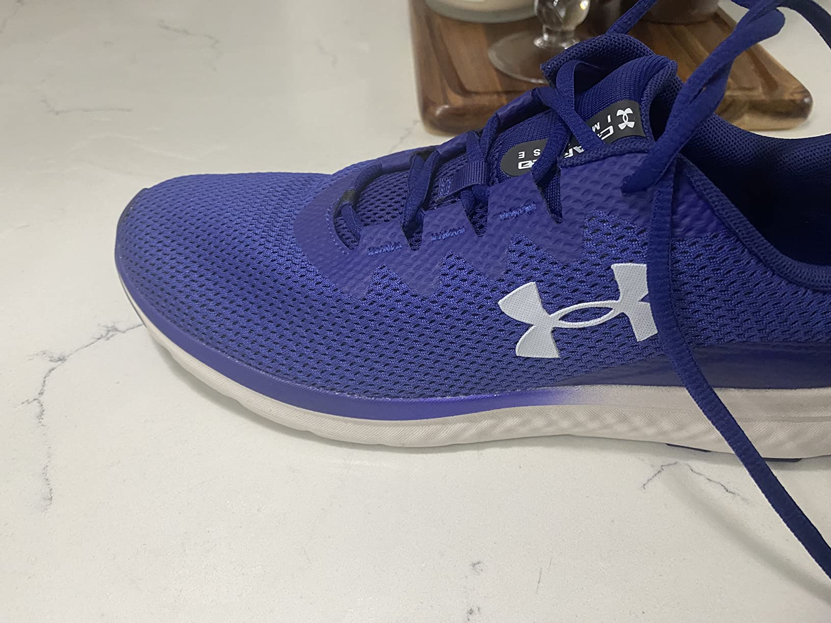Under Armour Charged Impulse 3 showing lightweight construction and ventilated upper design