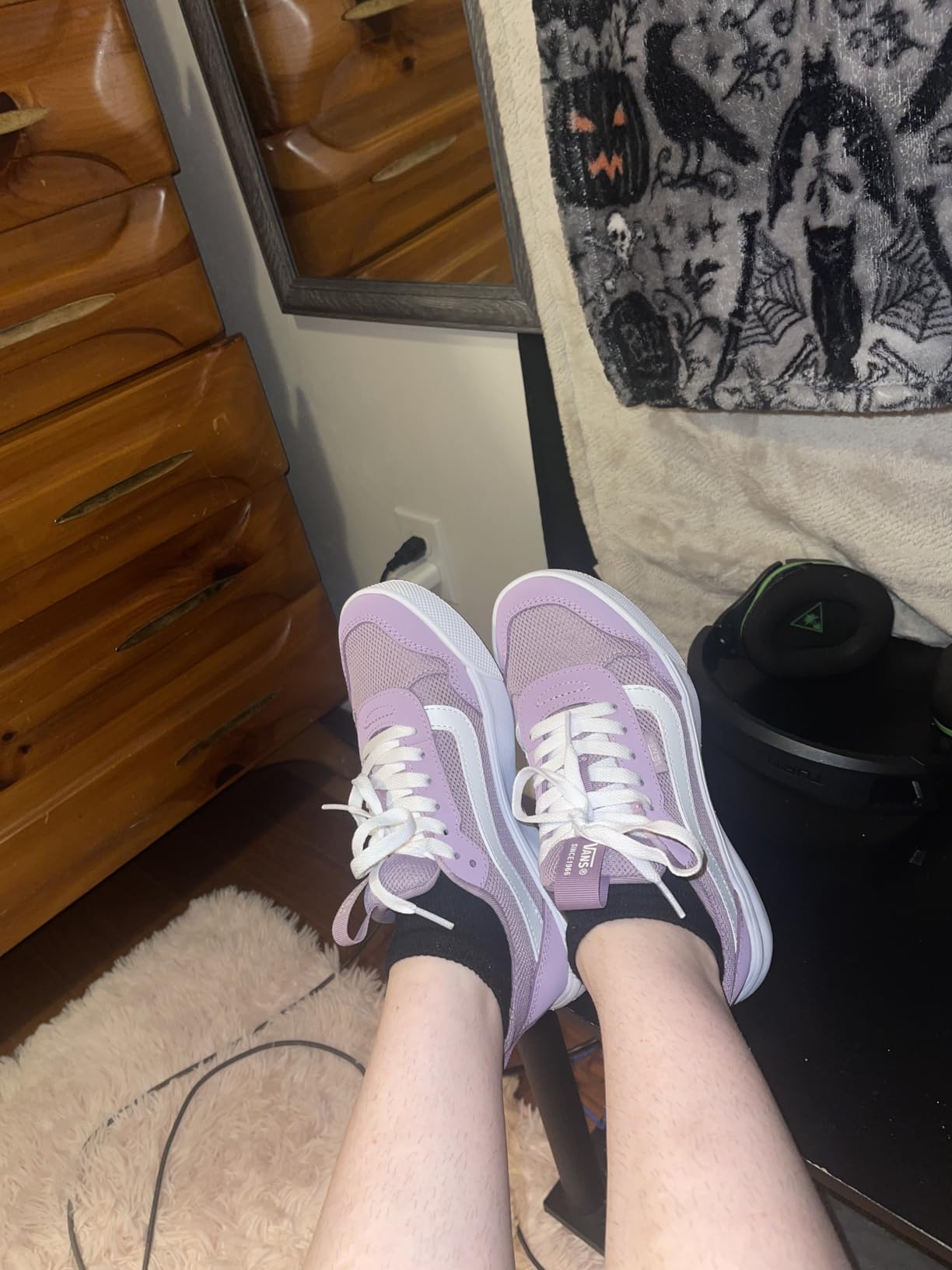 Vans Women's Range EXP sneaker black and white colorway showing outdoor-inspired design