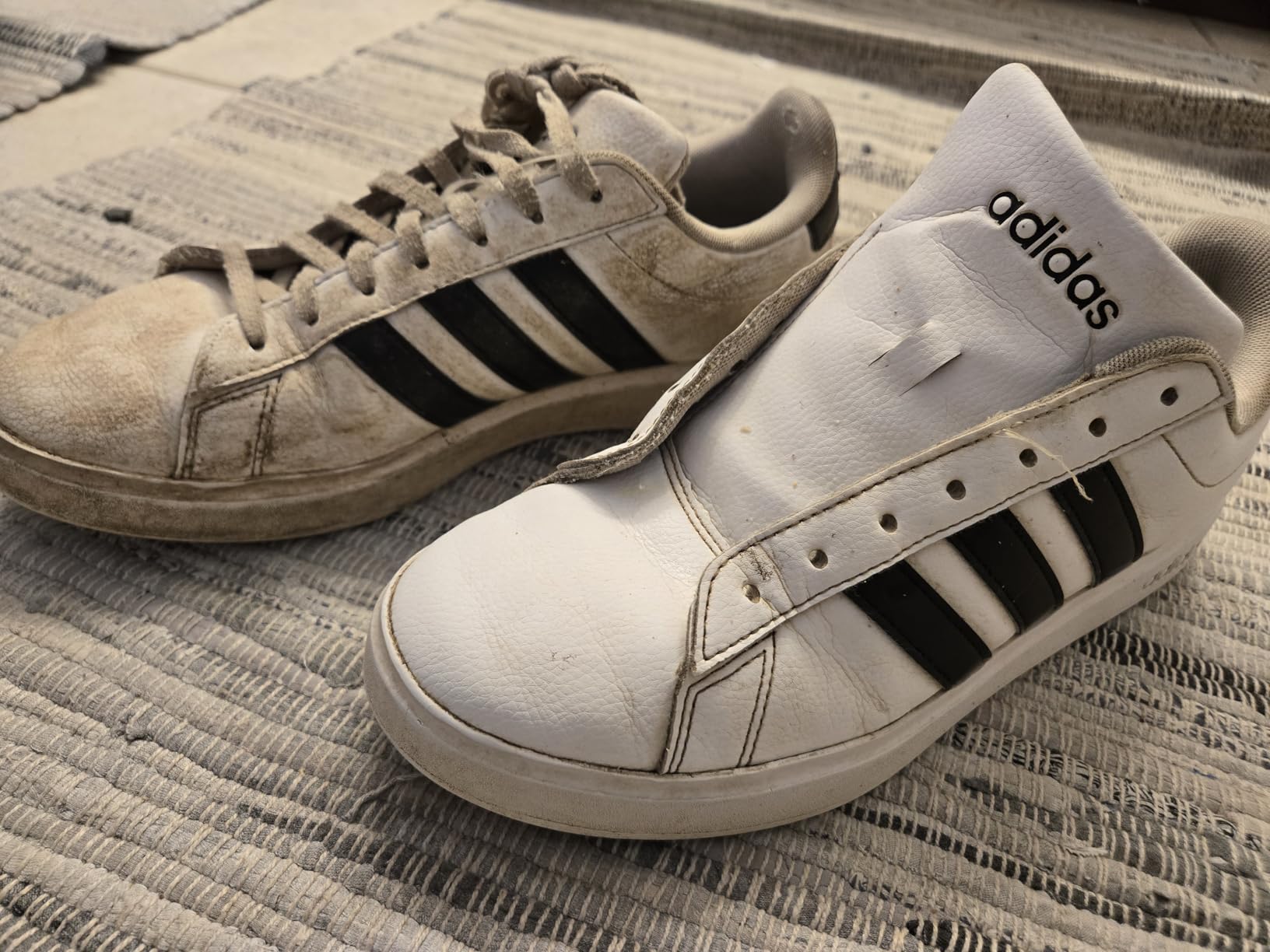 Before photo showing extremely dirty sneakers with mud and grime buildup