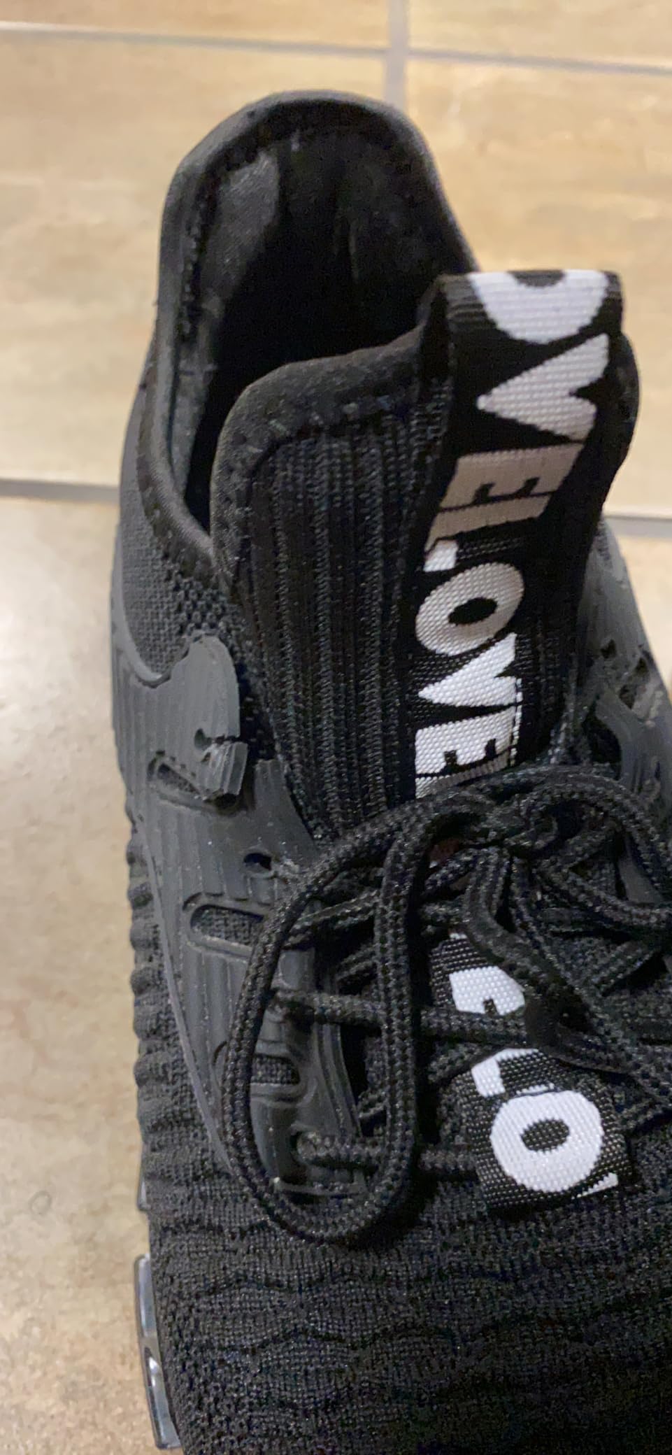 Men's Running Shoes showing breathable knitted upper material and slip-on construction