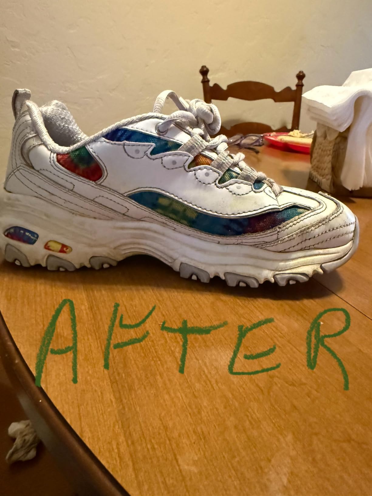 Grandma's Secret Sneaker Cleaner bottle with before and after shoes showing dramatic cleaning results