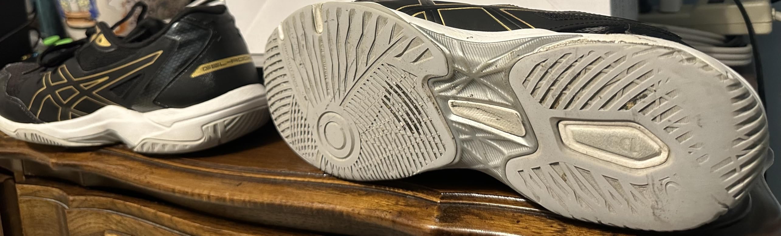 ASICS Gel-Rocket 10 showing heel wear pattern after 6 months of regular court sports use