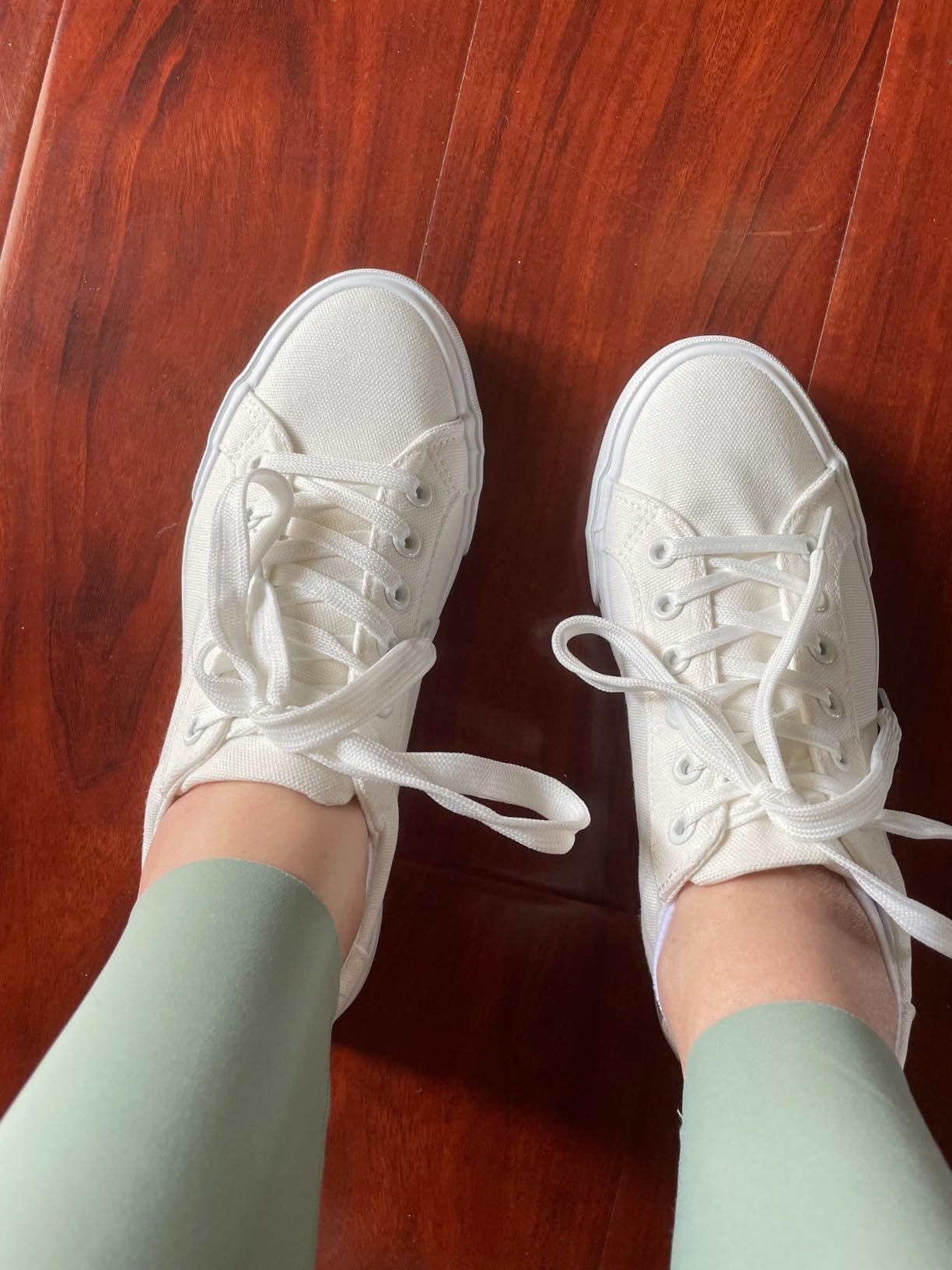 Witwatia sneakers in natural lighting showing actual off-white color and casual styling
