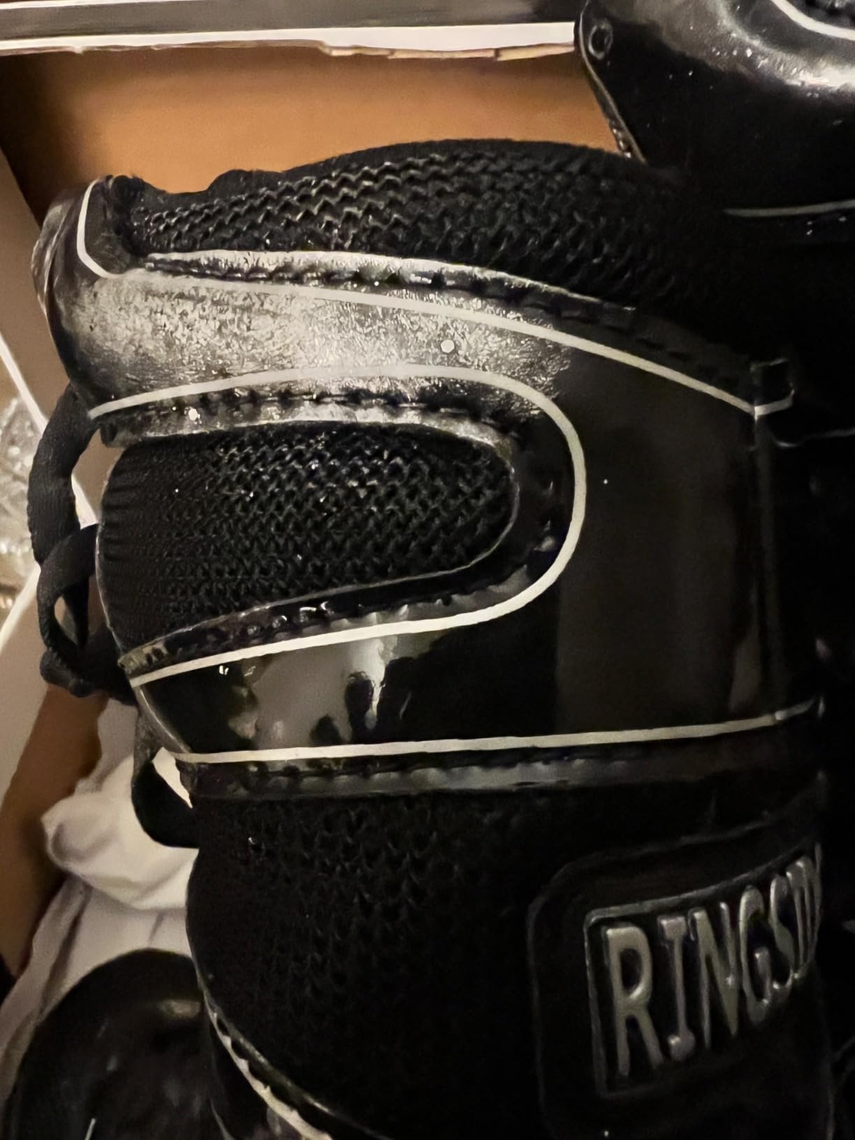 Ringside Diablo Boxing Shoes black high-top design showing ankle support and boxing gym setting