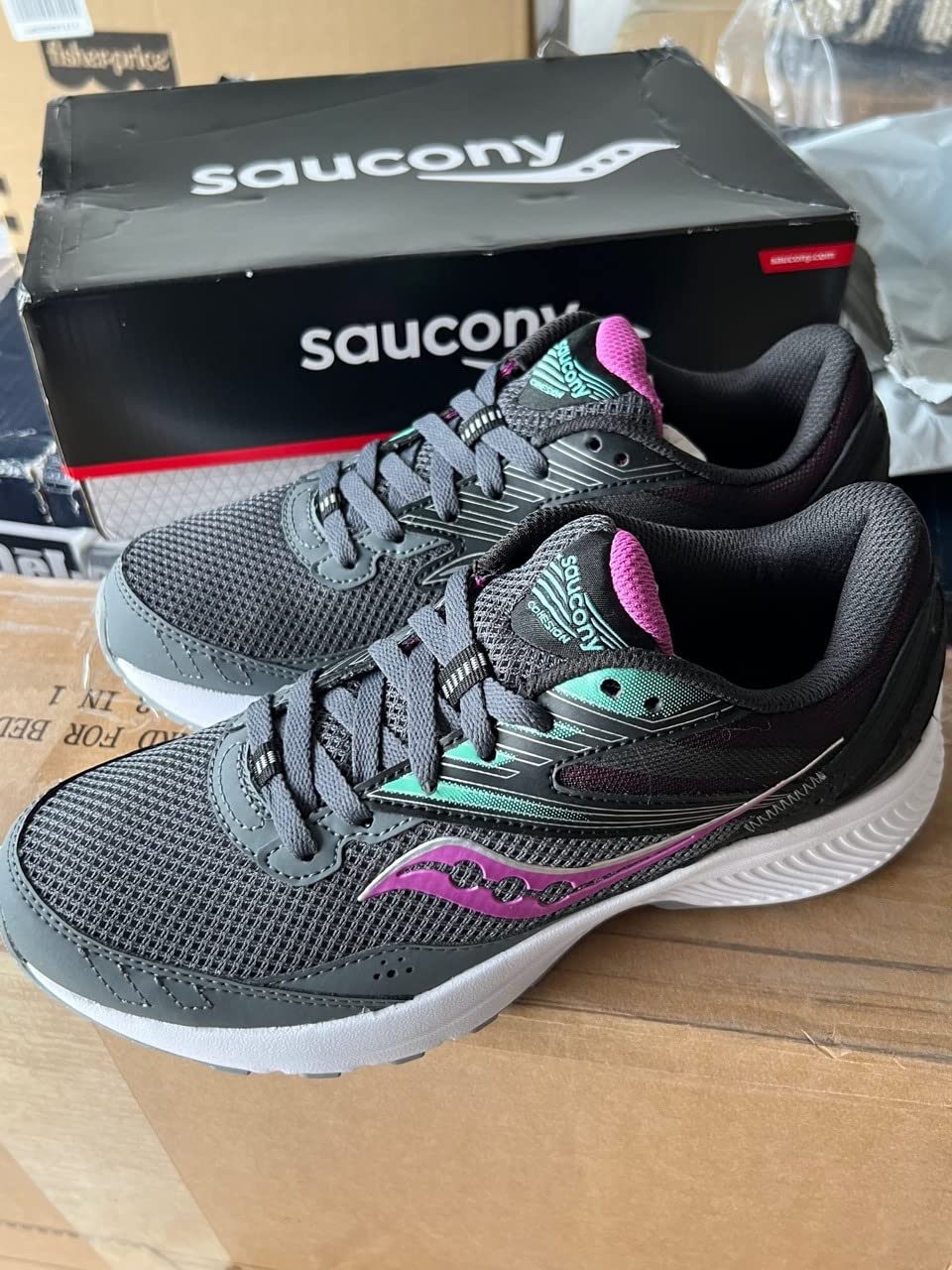 Saucony Cohesion 15 in grey and pink colorway showing design details and color combination
