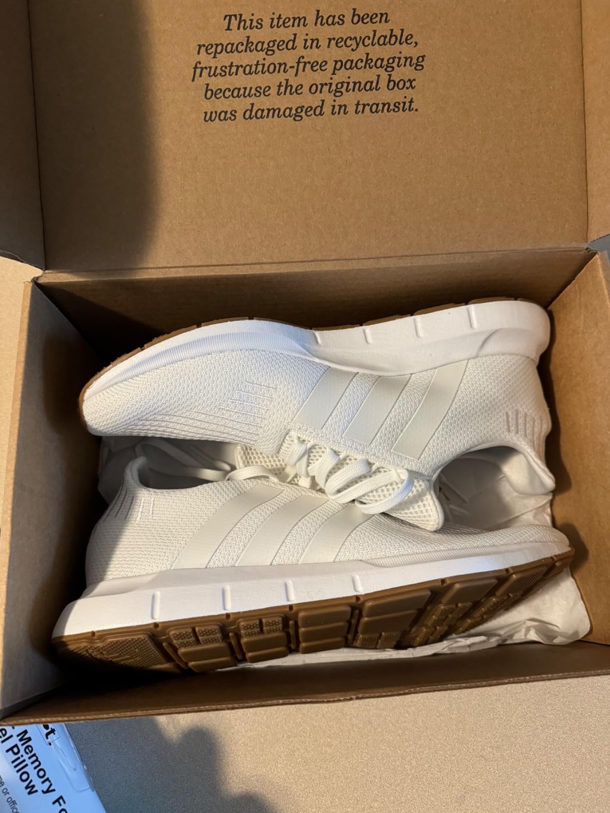 Side profile view of Adidas Swift Run showing EVA midsole and overall proportions