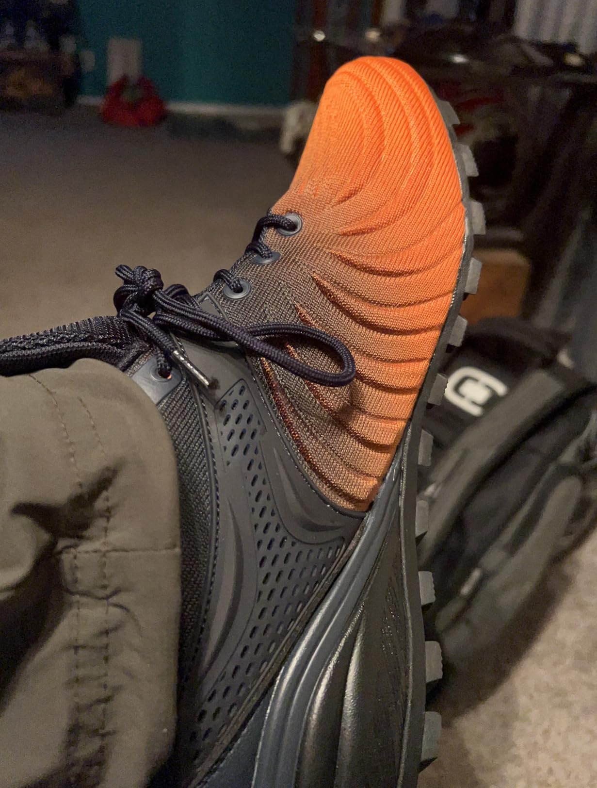 Bottom view of Kricely walking shoes showing aggressive rubber tread pattern for traction