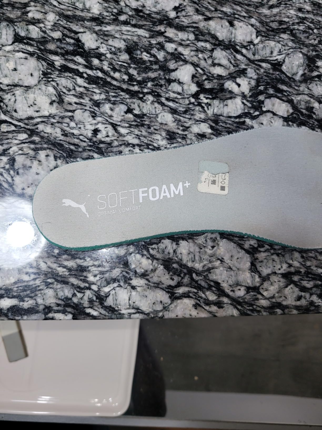 Mens blade sneakers with aftermarket gel insoles showing improvement attempts