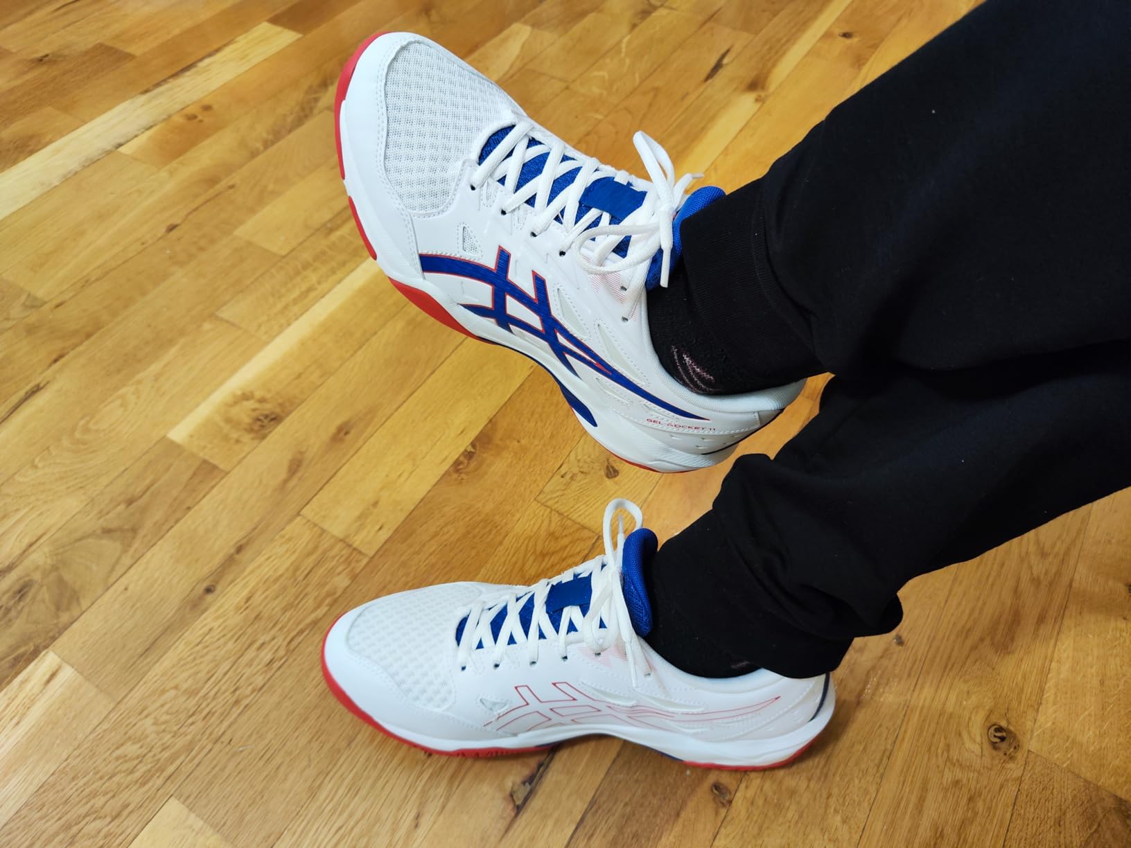 Asics Gel-Rocket 11 showing detailed upper construction with mesh breathability and support overlays