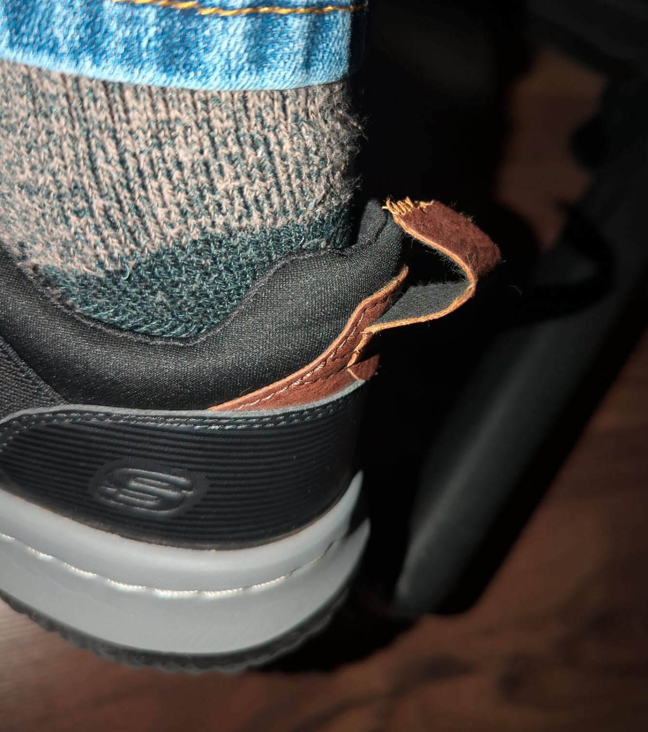 Close-up view of Skechers Delson-Camden showing bungee lace system and pull tabs
