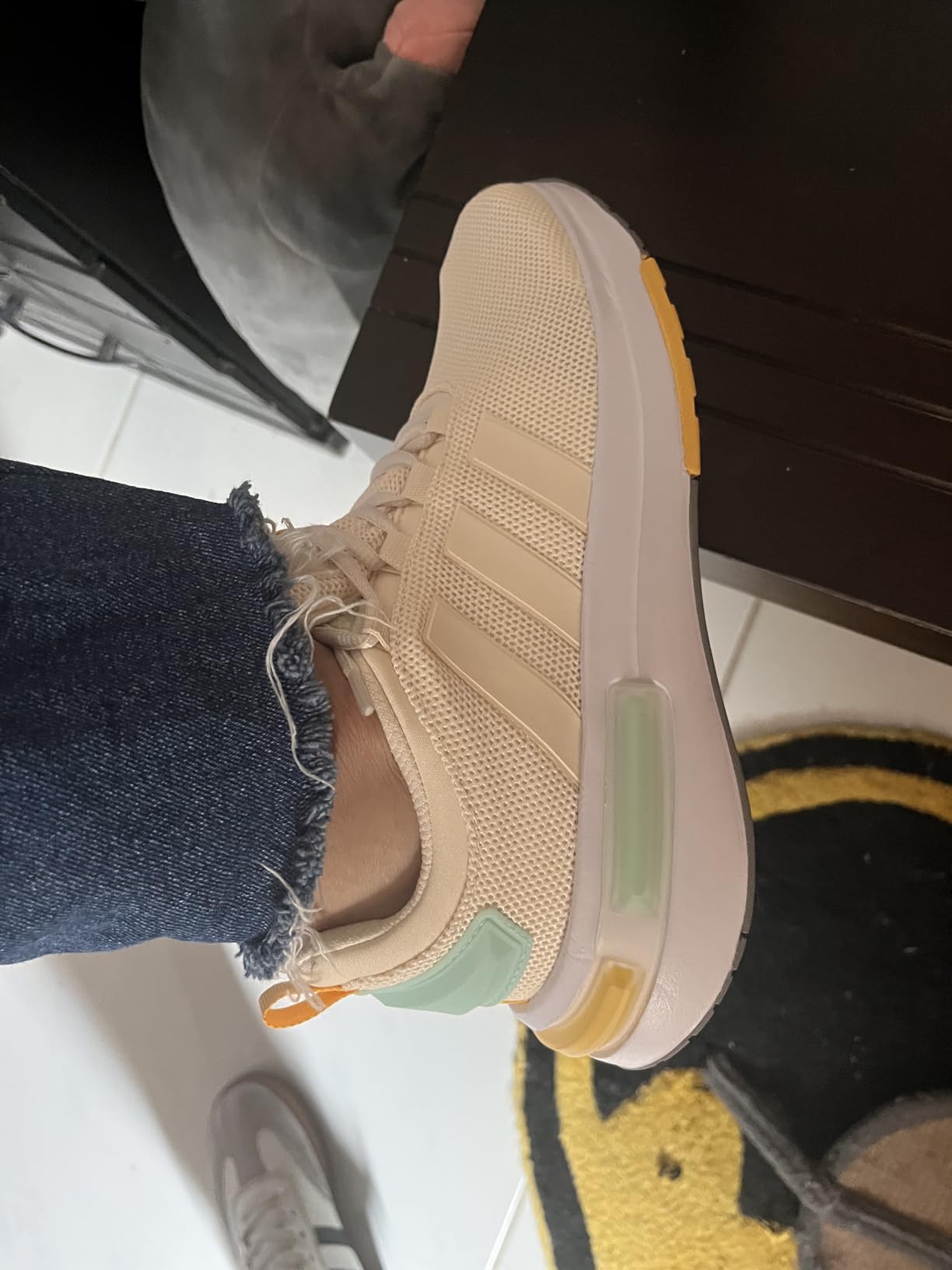 adidas Racer Tr23 detail showing three-stripes branding and mesh construction elements