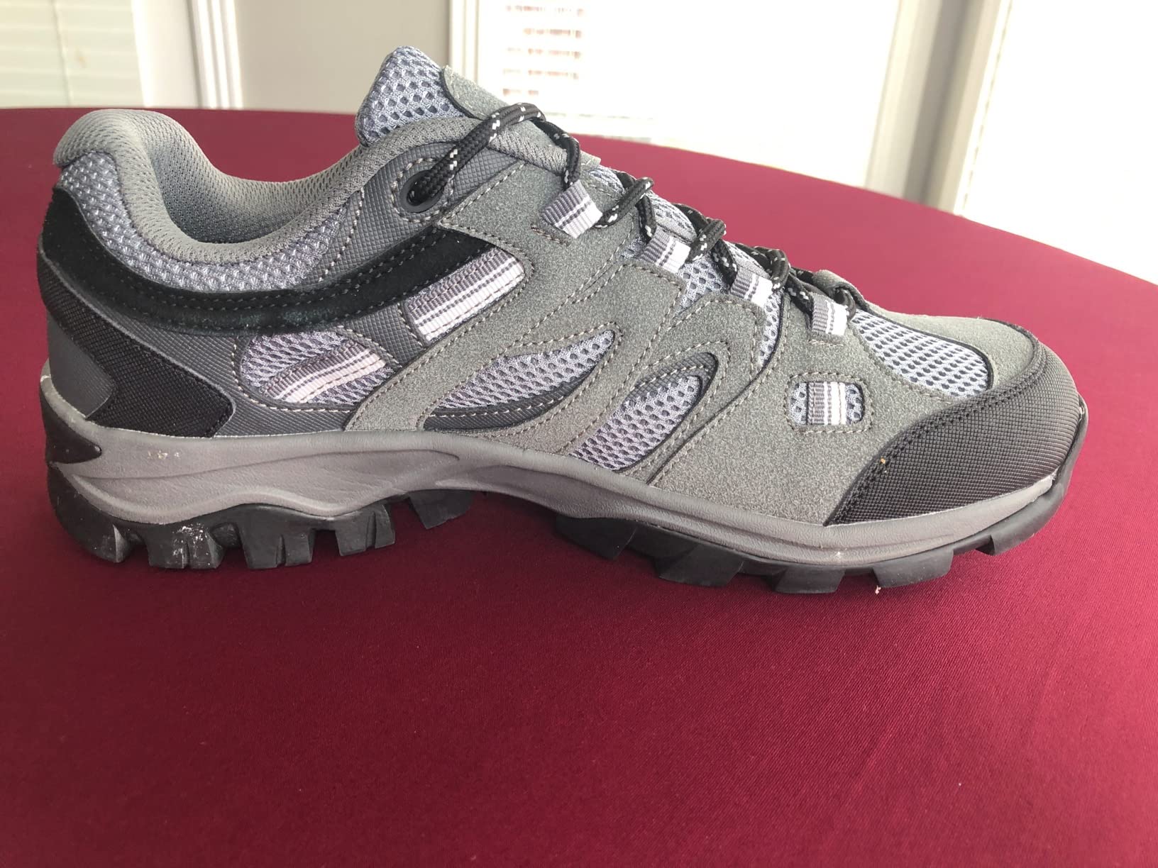Close-up view of CAMELSPORTS hiking shoe toe protection and lacing system