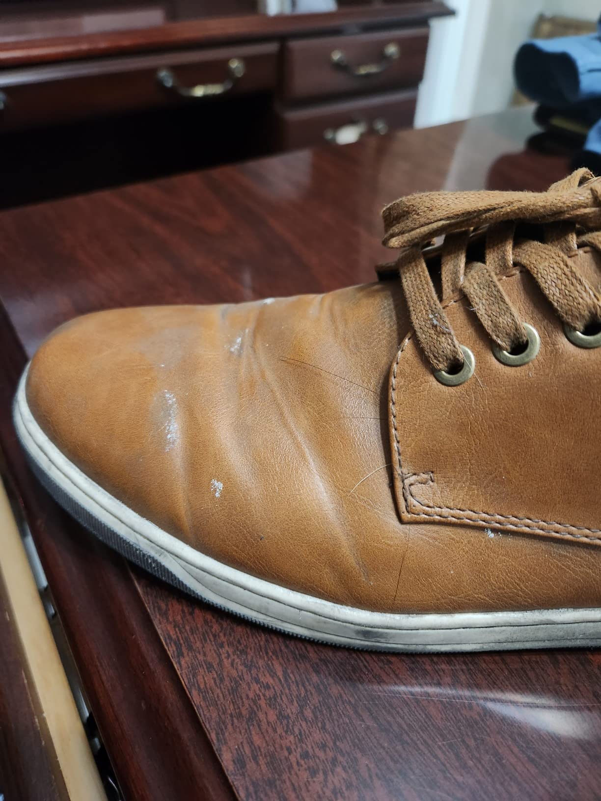 Durability issues showing cracking at ball of foot area on Jousen dress sneaker