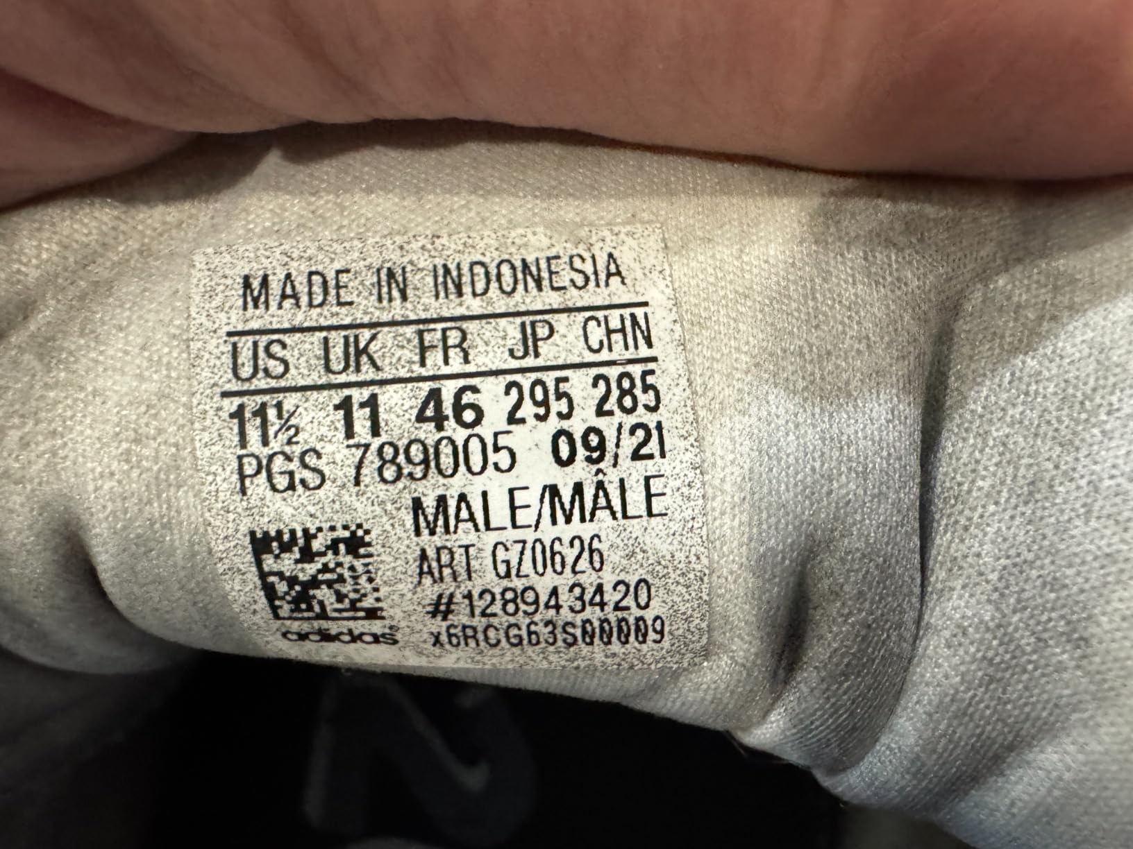 Adidas Questar upper construction showing textile mesh and three stripes design