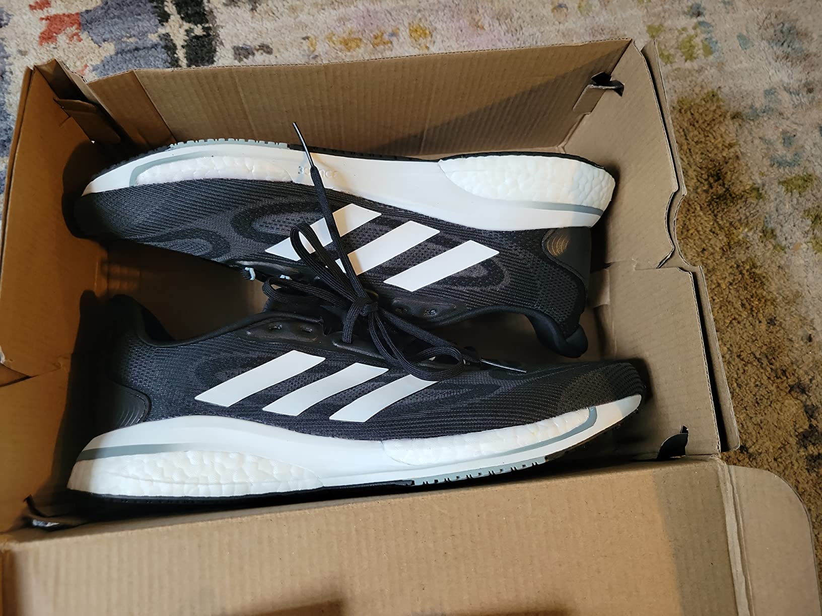 Adidas Supernova mesh upper construction showing breathable design and three stripes branding