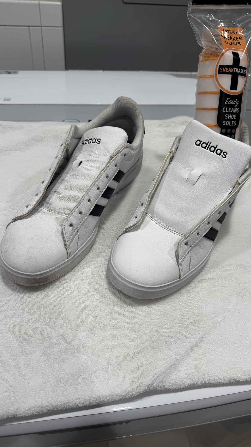Close-up of SneakERASERS product packaging showing premium claims and dual-sided design